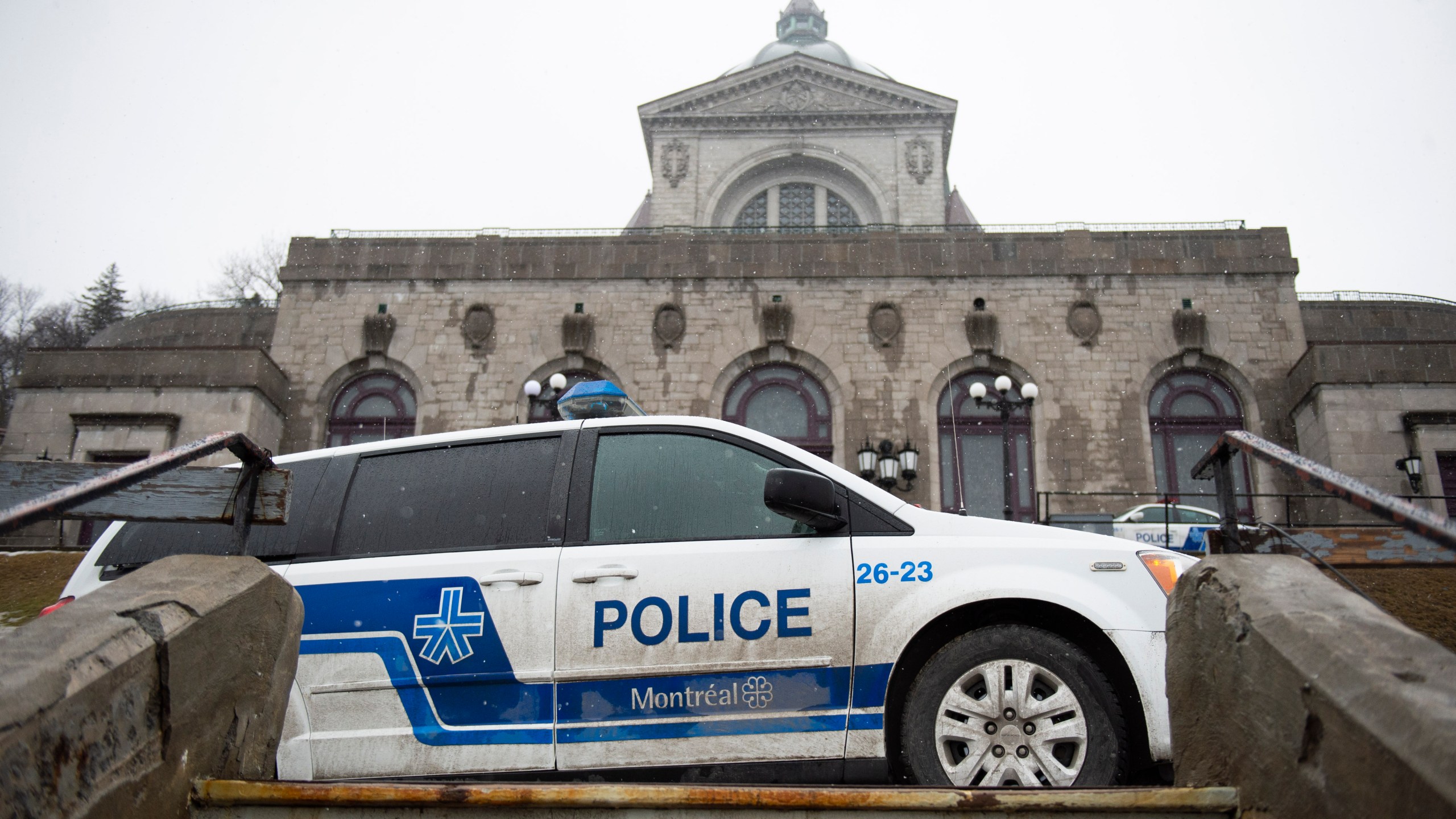 Police provide security at Saint Joseph's Oratory in Montreal on March 22, 2019, after Catholic Priest Claude Grou was stabbed during a livestreamed morning mass. (Credit: Sebastien St-Jean/AFP/Getty Images