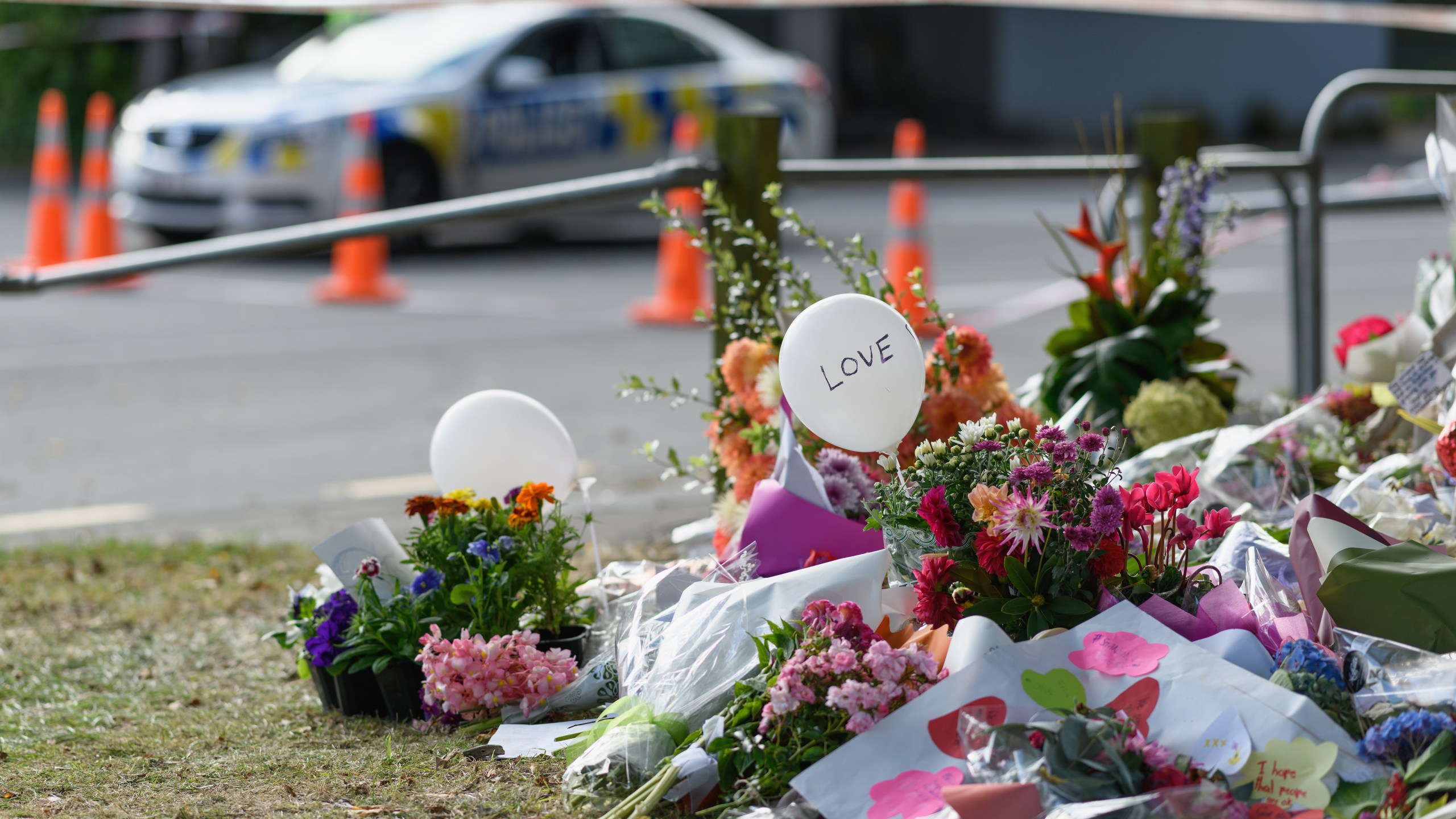 Flowers and condolences are seen in front of Al Noor mosque on March 20, 2019 in Christchurch, New Zealand. 50 people were killed, and dozens are still injured in hospital after a gunman opened fire on two Christchurch mosques on Friday, 15 March. The accused attacker, 28-year-old Australian, Brenton Tarrant, has been charged with murder and remanded in custody until April 5. The attack is the worst mass shooting in New Zealand's history. (Credit: Kai Schwoerer/Getty Images)