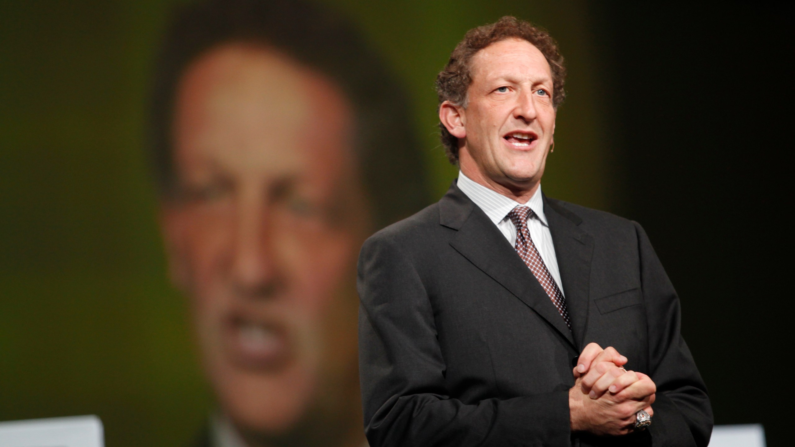 San Francisco Giants President Larry Baer appears to the stage to award Oracle CEO Larry Ellison the 2010 World Series ring at the Moscone Center in San Francisco during the Oracle OpenWorld 2011 on October 2, 2011. (Credit: KIMIHIRO HOSHINO/AFP/Getty Images)