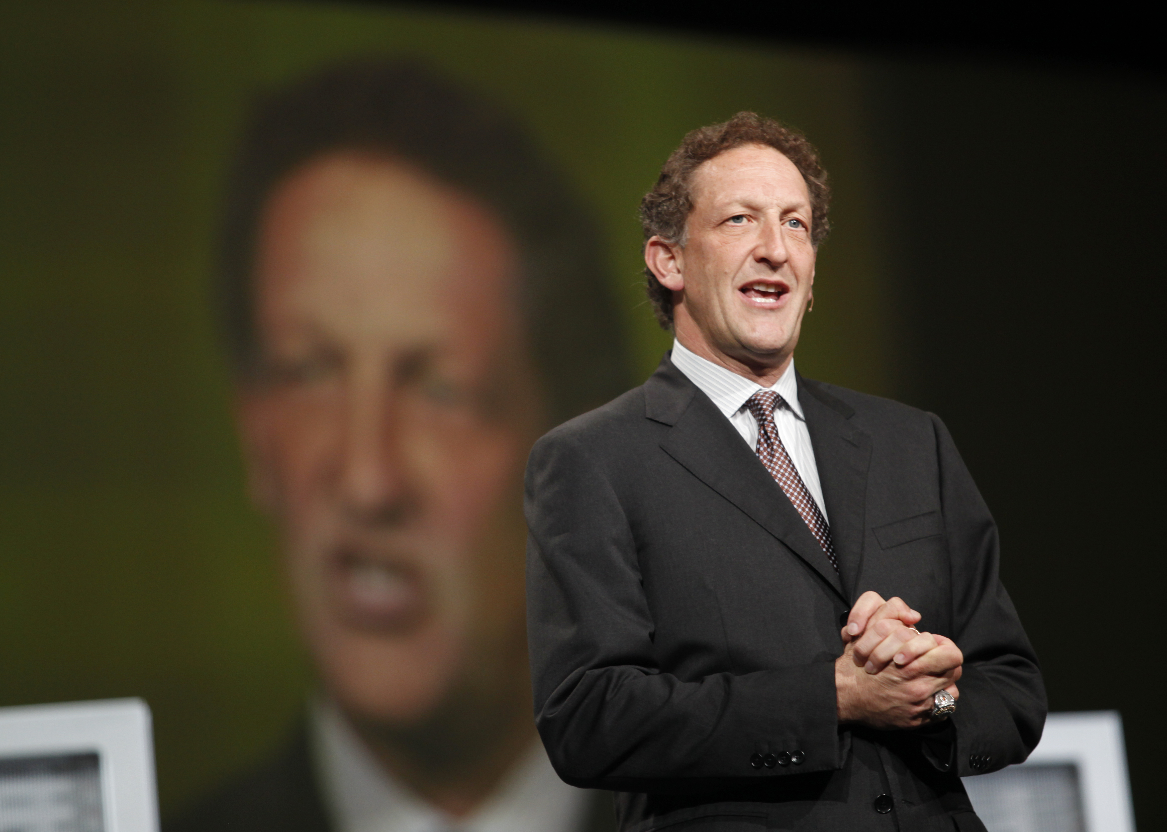 San Francisco Giants President Larry Baer appears to the stage to award Oracle CEO Larry Ellison the 2010 World Series ring at the Moscone Center in San Francisco during the Oracle OpenWorld 2011 on October 2, 2011. (Credit: KIMIHIRO HOSHINO/AFP/Getty Images)