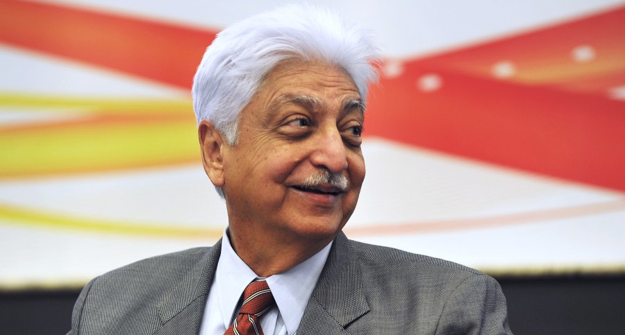 Indian Chairman of Wipro Limited, Azim Premji, smiles during a press conference held to announce the company's 2nd quarter results in Bangalore on November 2, 2012. (Credit: Manjunath Kiran/AFP/Getty Images)