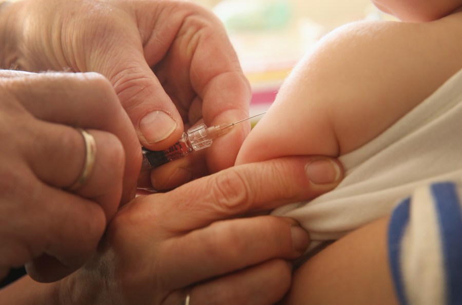 A children's doctor injects a vaccine against measles, rubella, mumps and chicken pox to an infant on Feb. 26, 2015, in Berlin, Germany. (Credit: Sean Gallup/Getty Images)