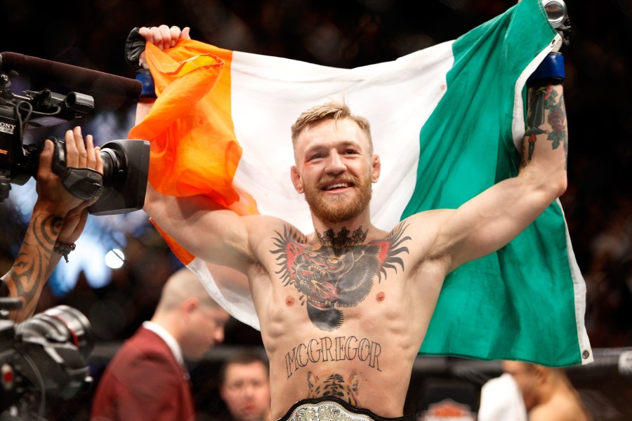 Conor McGregor celebrates after a first-round knockout victory over Jose Aldo in their featherweight title fight during UFC 194 on December 12, 2015 in Las Vegas, Nevada. (Credit: Steve Marcus/Getty Images)