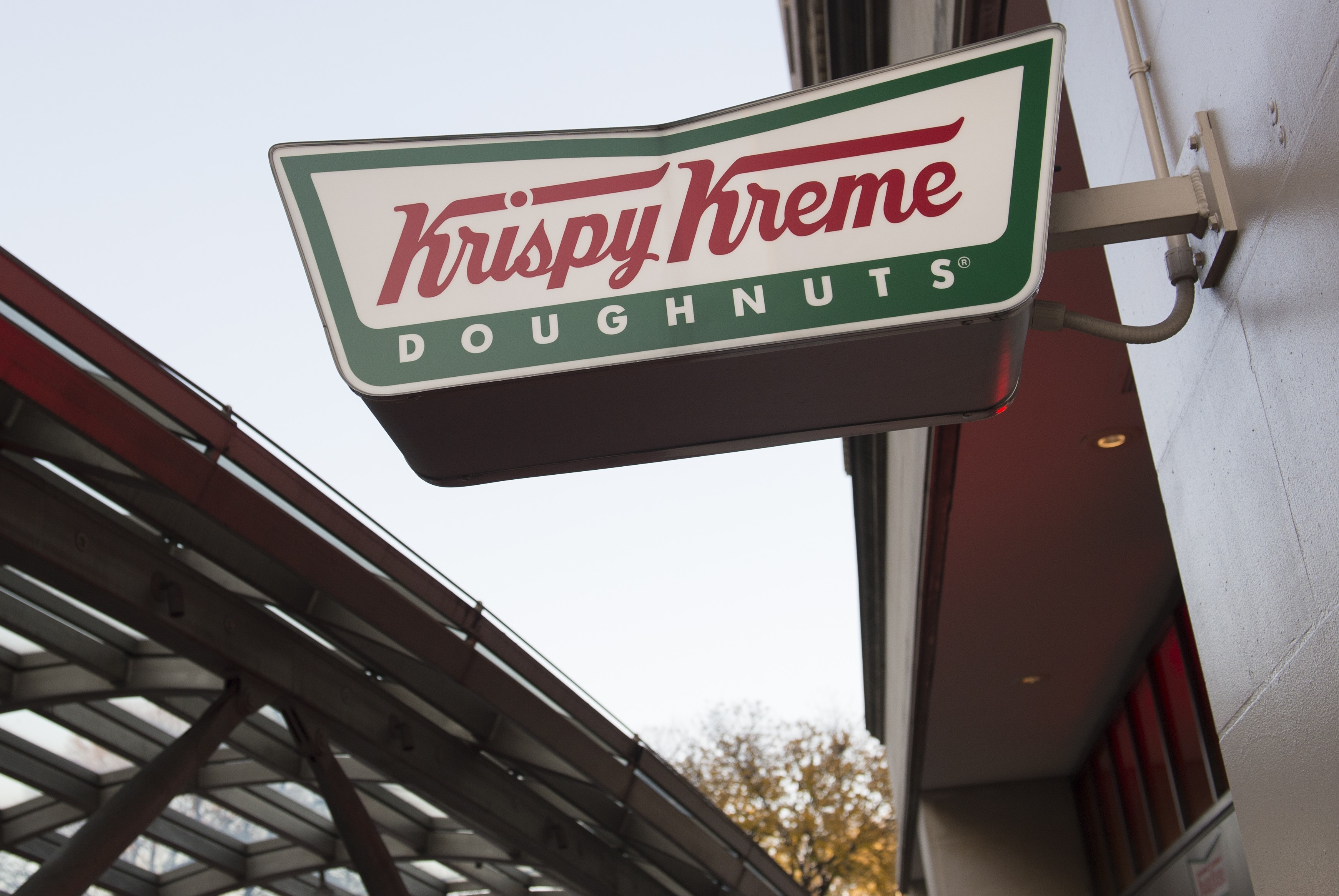 A sign for Krispy Kreme doughnuts is seen outside their store in Washington, DC, December 1, 2016. (Credit: SAUL LOEB/AFP/Getty Images)