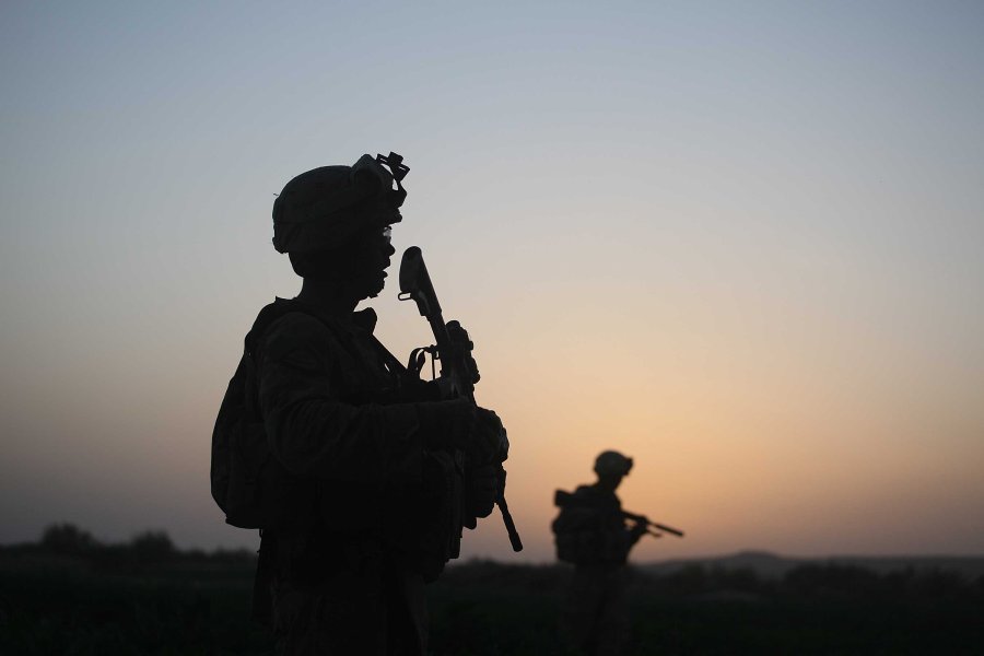 U.S. Marines with the 2nd Marine Expeditionary Brigade, RCT 2nd Battalion 8th Marines Echo Co. step off in the early morning during an operation to push out Taliban fighters on July 18, 2009 in Herati, Afghanistan . (Credit; Joe Raedle/Getty Images)