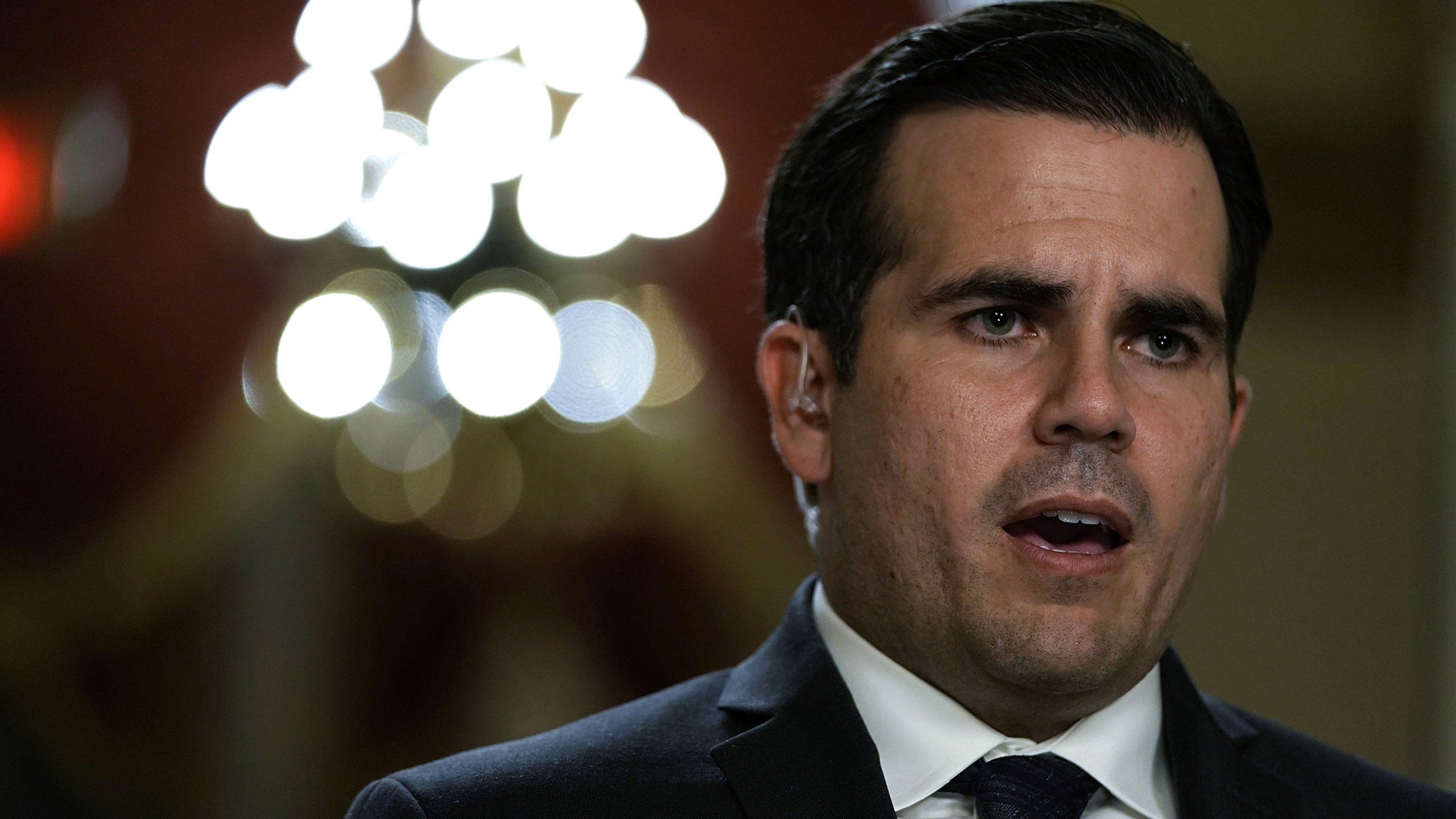 Puerto Rican Gov. Ricardo Rossello is interviewed by a TV channel after a House vote at the Capitol December 21, 2017. (Credit: Alex Wong/Getty Images)