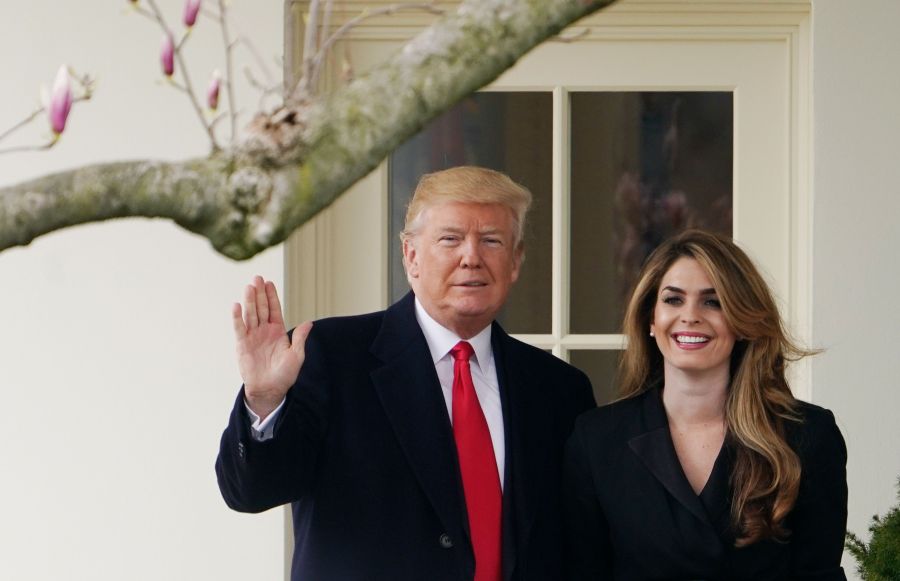 Donald Trump poses with Hope Hicks on the White House South Lawn on March 29, 2018. (Credit: Mandel Ngan/AFP/Getty Images)