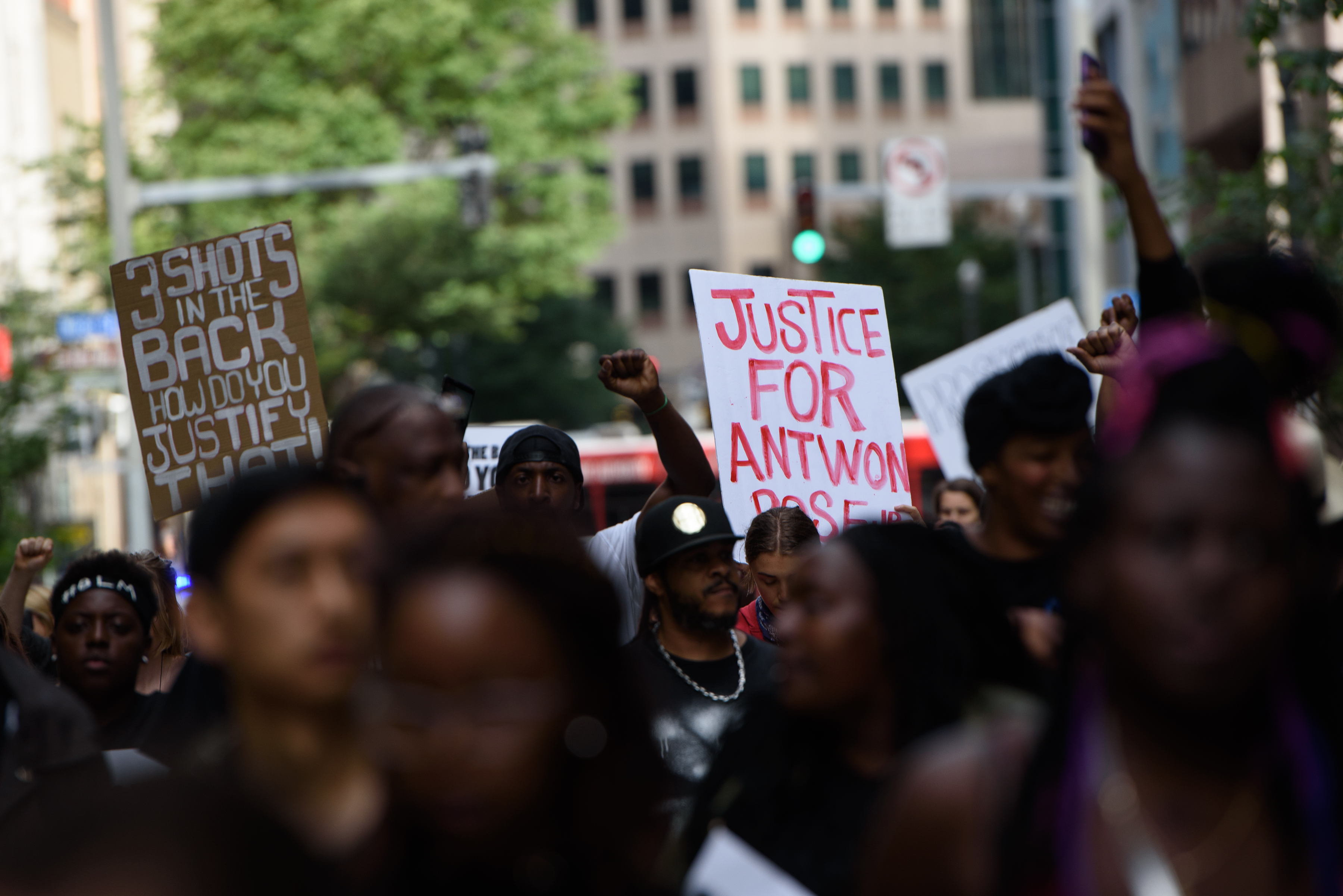 A demonstrator holds up a sign that reads "Justice for Antwon Rose" during a protest a day after the funeral for Rose on June 26, 2018 in downtown Pittsburgh, Pennsylvania.(Credit: Justin Merriman/Getty Images)