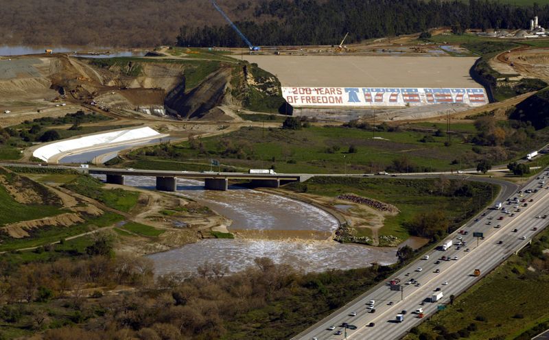 The bicentennial mural painted on the Prado Dam spillway in Corona, shown here in 2005, greets motorists entering Riverside County at the intersection of the 91 and 71 freeways. (Credit: Irfan Khan / Los Angeles Times)