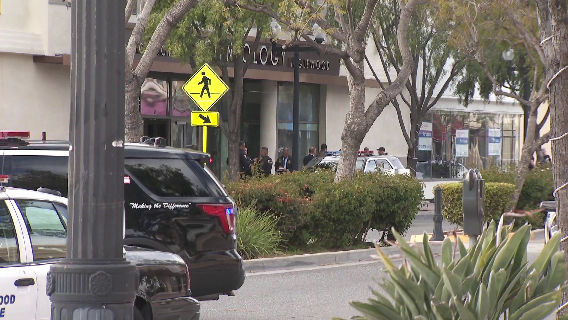 Police surround the scene of a deadly officer-involved shooting at the Church of Scientology in Inglewood on March 27, 2019. (Credit: KTLA)