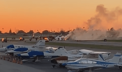 Smoke rises over the scene of a two-plane crash at the Compton/Woodley Airport on March 13, 2019. (Credit: John Medford/Facebook)