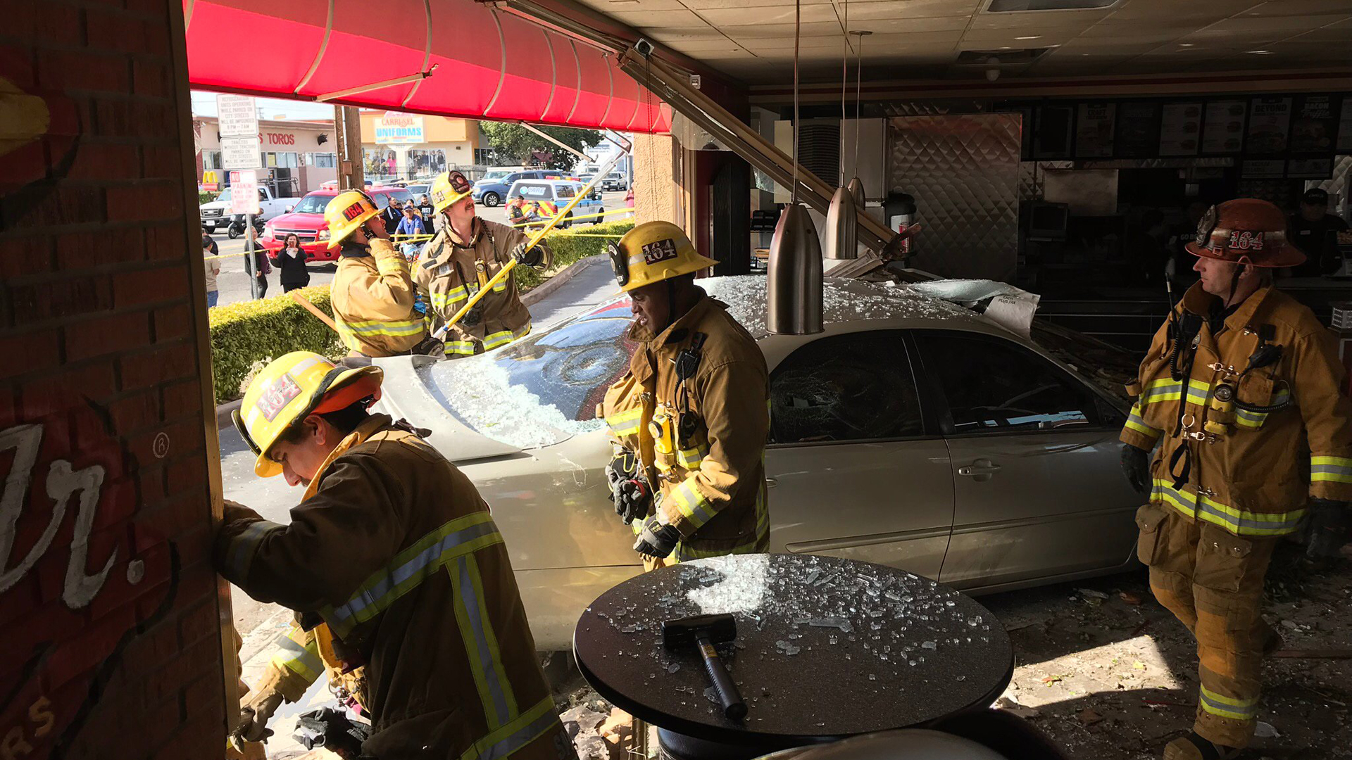 A car is seen after slamming into a Carl's Jr. in Huntington Park following a crash on April 1, 2019, in an image tweeted by the Los Angeles County Fire Department.
