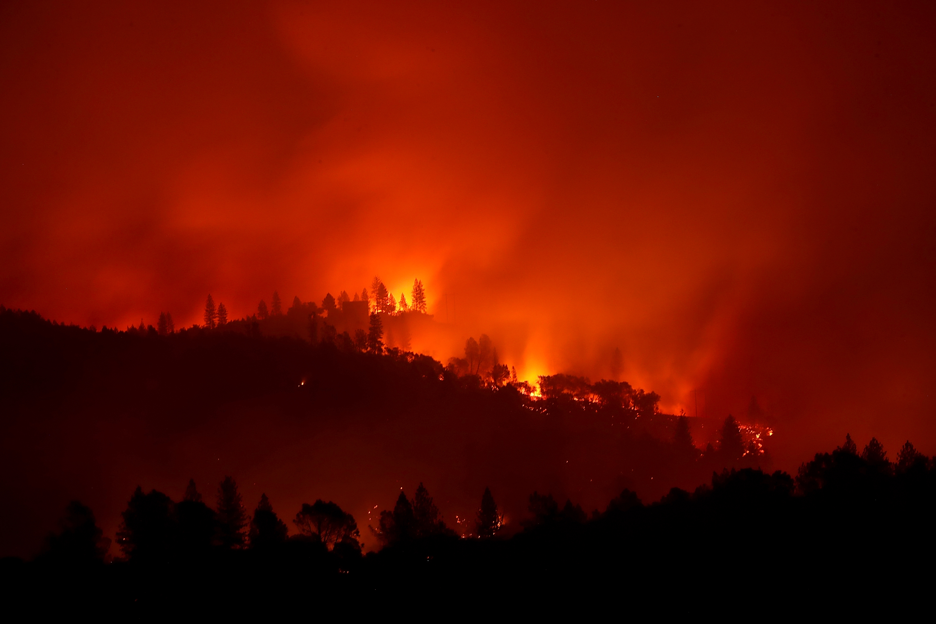 The Camp Fire burns in the hills on Nov. 10, 2018, near Ororville, California. (Credit: Justin Sullivan/Getty Images)