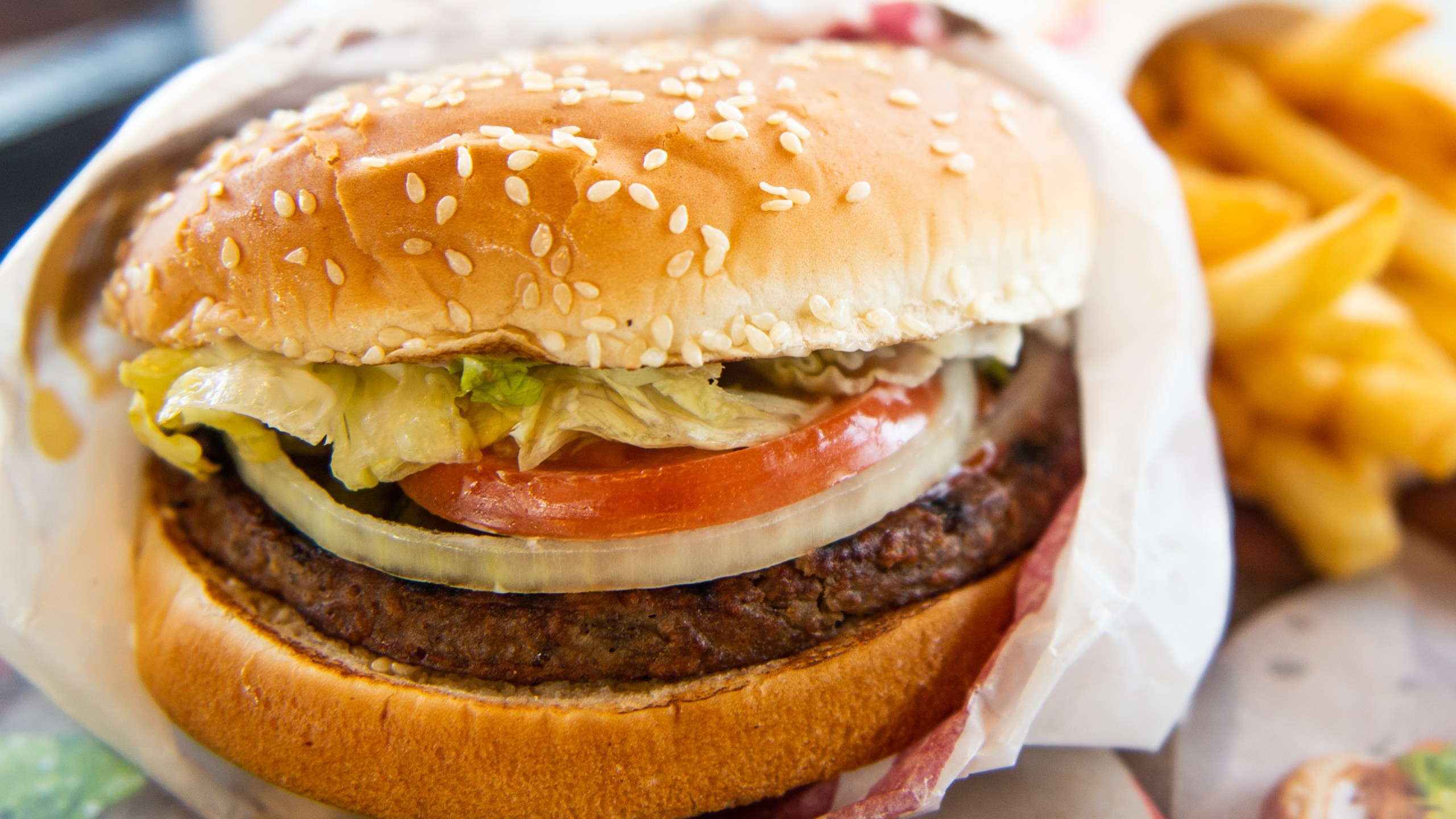 In this photo illustration, an 'Impossible Whopper' sits on a table at a Burger King restaurant on April 1, 2019 in Richmond Heights, Missouri. (Credit: Michael Thomas/Getty Images)