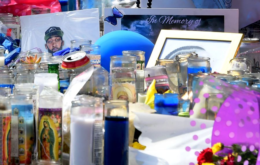 A makeshift memorial for Grammy-nominated rapper Nipsey Hussle sits in the parking lot in front of his Marathon Store in Los Angeles on April 2, 2019. (Credit: FREDERIC J. BROWN/AFP/Getty Images)