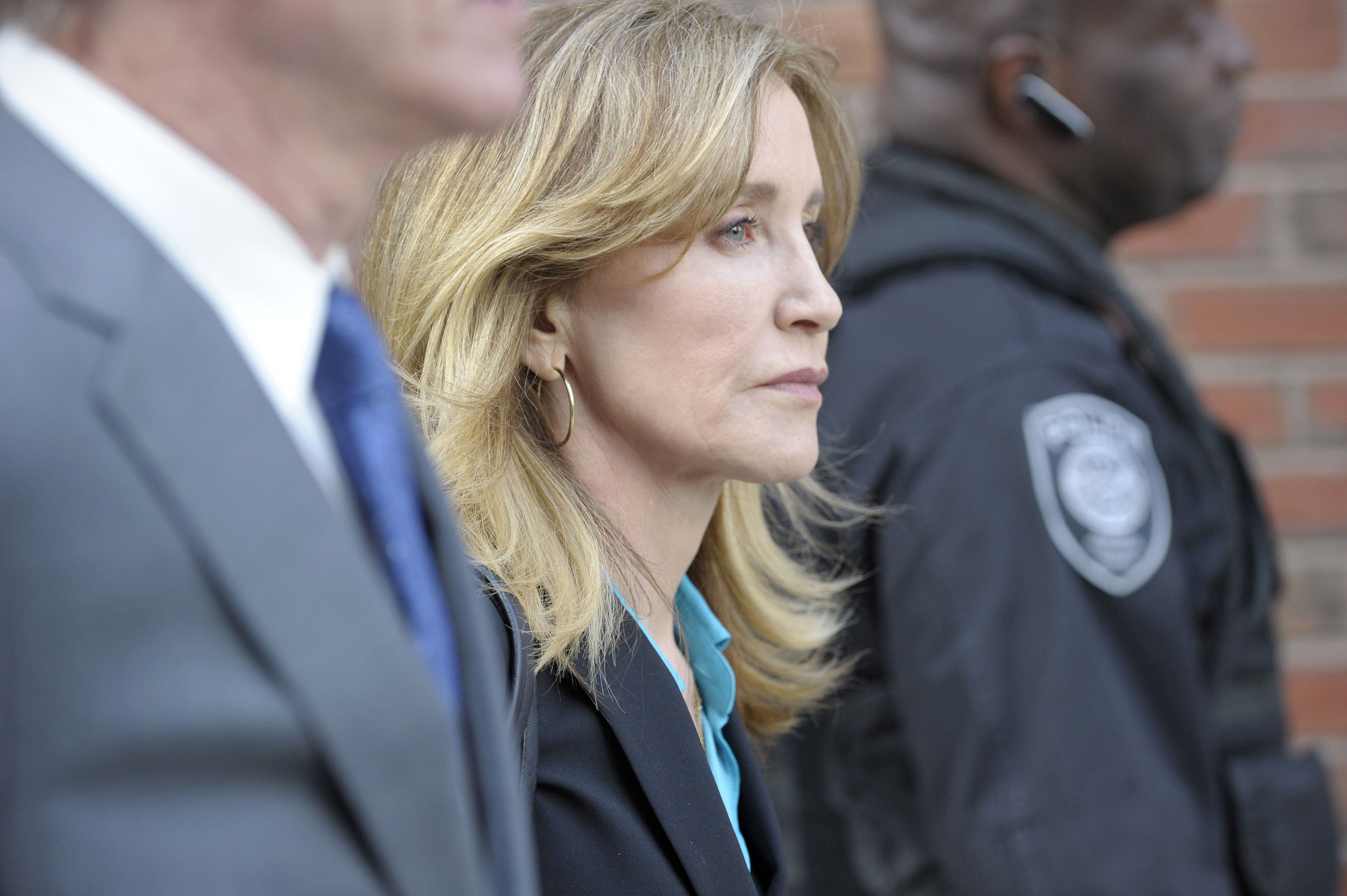 Actress Felicity Huffman exits the John Joseph Moakley United States Courthouse in Boston on April 3, 2019. (Credit: JOSEPH PREZIOSO/AFP/Getty Images)