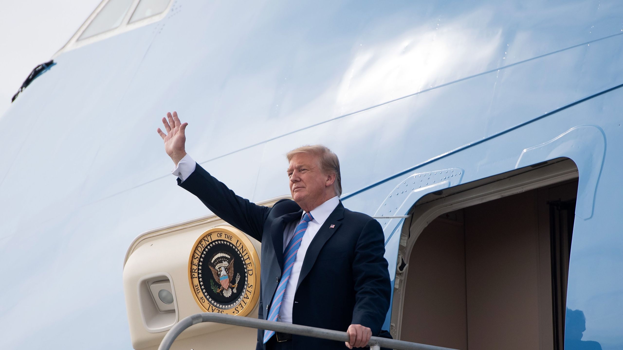 President Donald Trump disembarks from Air Force One upon arrival at Los Angeles International Airport on April 5, 2019, as he arrives to attend fundraisers. (Credit: Saul Loeb / AFP / Getty Images)