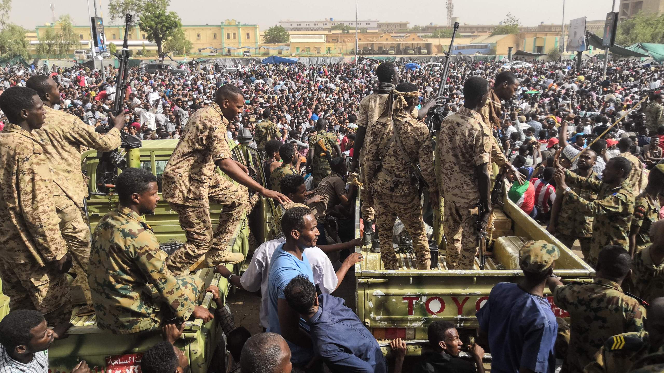 Sudanese soldiers stand guard on armoured military vehicles as demonstrators continue their protest against the regime near the army headquarters in the Sudanese capital Khartoum on April 11, 2019.(Credit: -/AFP/Getty Images)