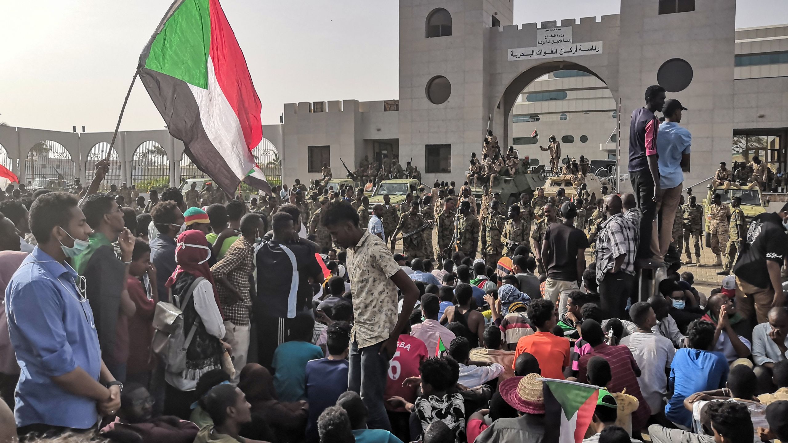 Sudanese soldiers stand guard on armoured military vehicles as demonstrators continue their rally against the regime near the army headquarters in the Sudanese capital Khartoum on April 11, 2019. (Credit: -/AFP/Getty Images)