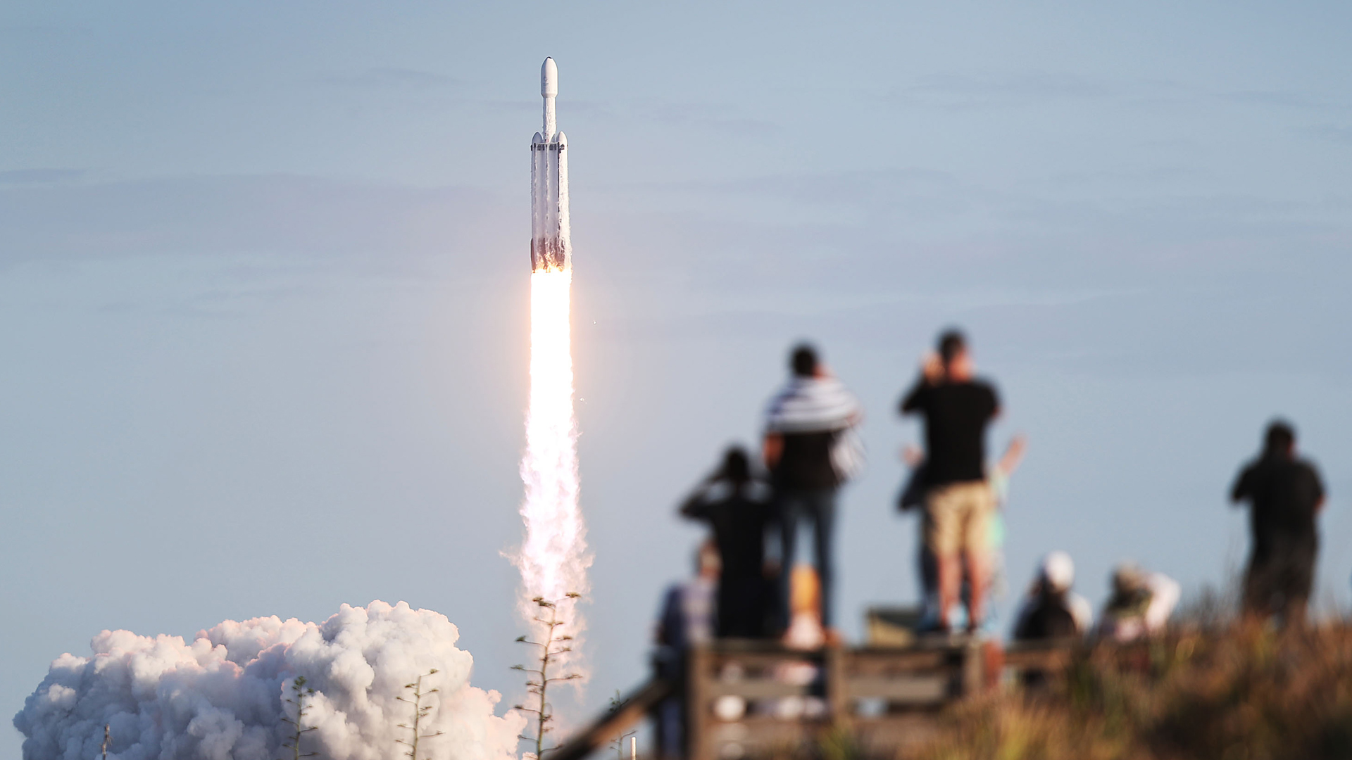 People watch as the SpaceX Falcon Heavy rocket lifts off from NASA's Kennedy Space Center on April 11, 2019, in Titusville, Florida. (Joe Raedle/Getty Images)