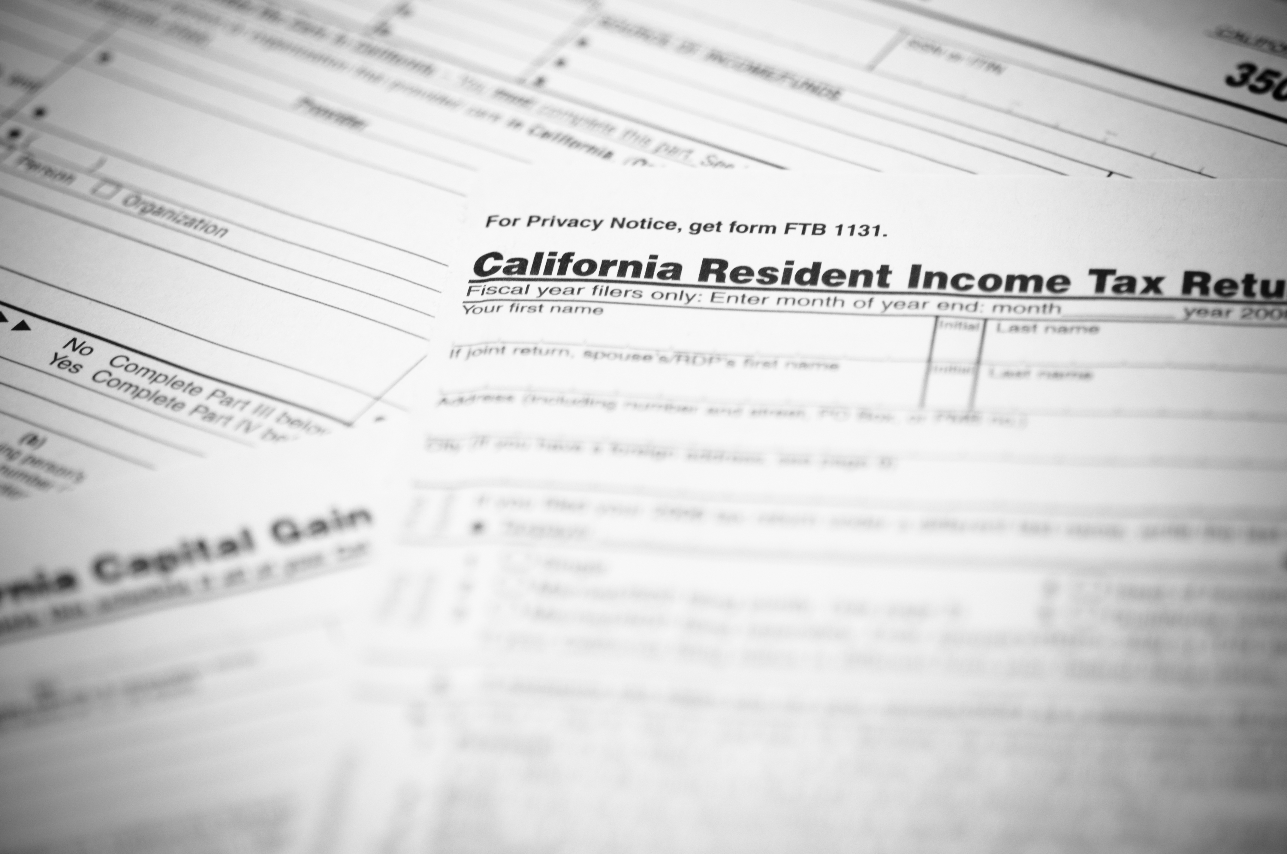 The California income tax form 540 with supplemental forms in the background in this file photo. (Credit: iStock / Getty Images Plus)