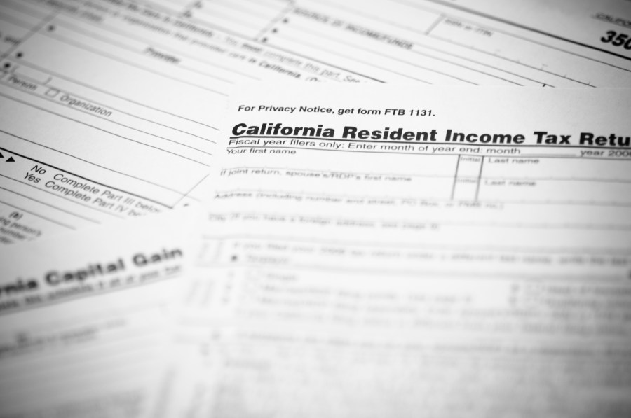 The California income tax form 540 with supplemental forms in the background in this file photo. (Credit: iStock / Getty Images Plus)