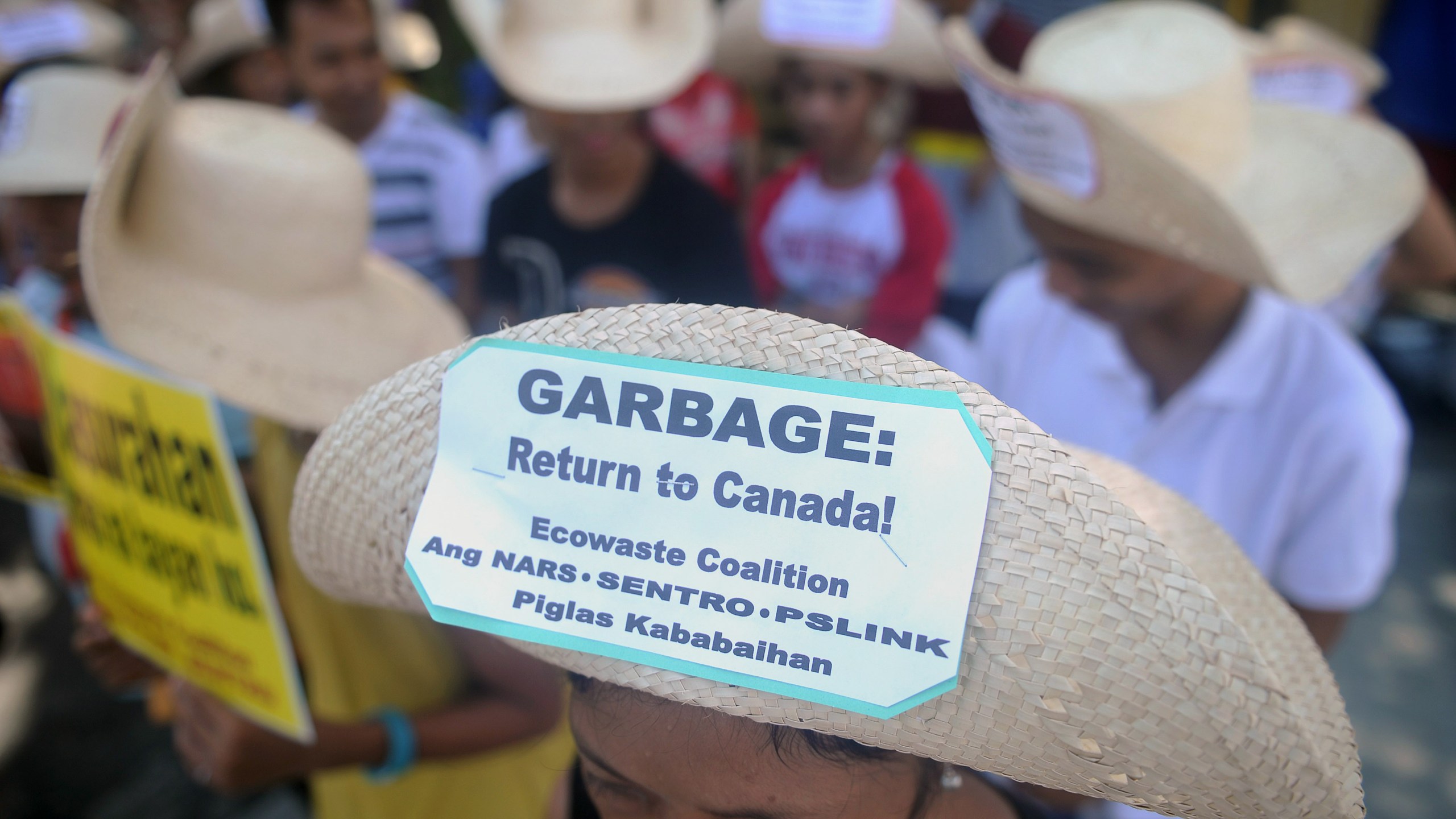 Environmental activists rally outside the Philippine Senate in Manila on September 9, 2015 to demand garbage be shipped back to Canada. (Credit: JAY DIRECTO/AFP/Getty Images)