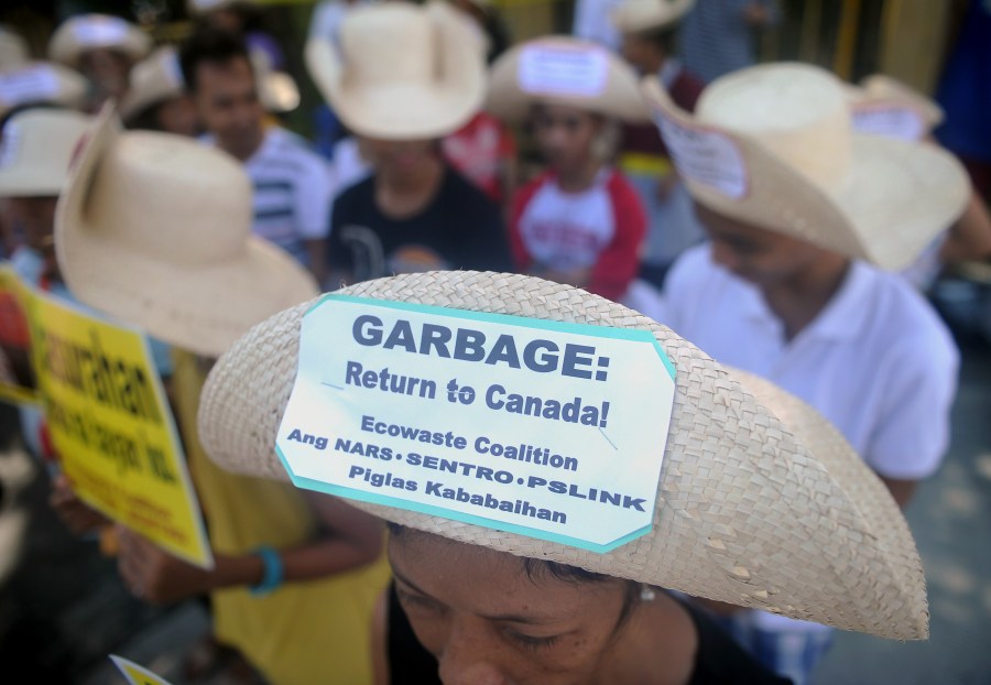 Environmental activists rally outside the Philippine Senate in Manila on September 9, 2015 to demand garbage be shipped back to Canada. (Credit: JAY DIRECTO/AFP/Getty Images)