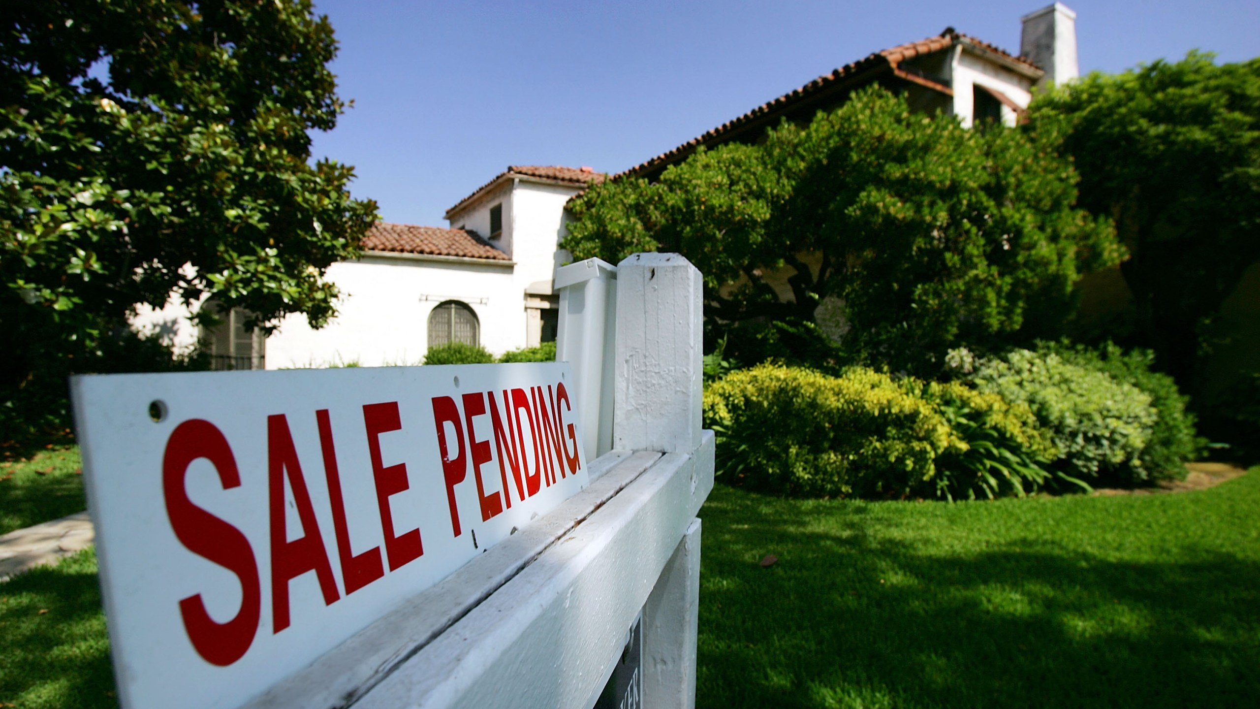 A Pasadena house is seen with a "For Sale" sign in a file photo. (David McNew/Getty Images)