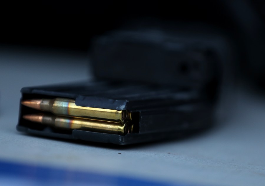 A surrendered assault rifle magazine with bullets sits on a table during a gun buyback event in San Francisco on Dec. 17, 2016. (Credit: Justin Sullivan / Getty Images)