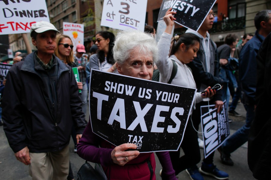 Protesters take part in the "Tax March" calling on Donald Trump to release his tax records on April 15, 2017 in New York. (KENA BETANCUR/AFP/Getty Images)