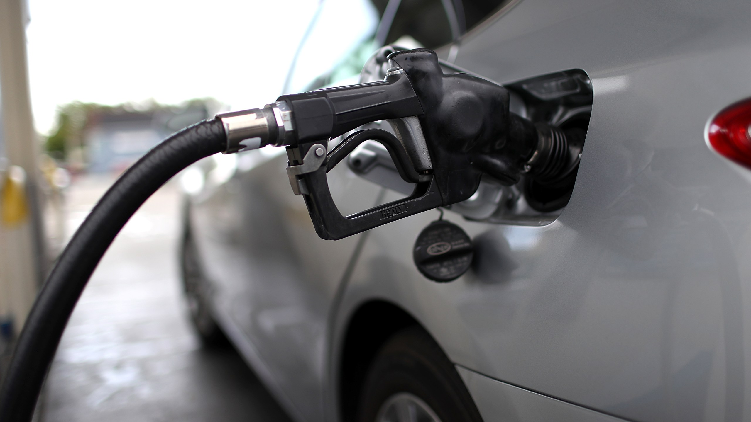 A gas pump fills a car with fuel at a gas station on May 10, 2017 in San Rafael. (Credit: Justin Sullivan/Getty Images)