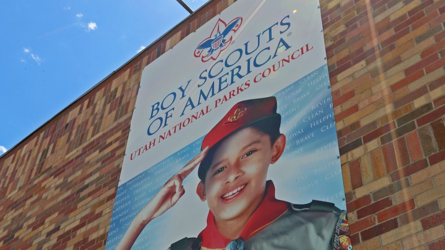 A sign hangs on the outside of the headquarters of the Utah National Park Council of the Boy Scouts of America on May 9, 2018, in Orem, Utah. (Credit: George Frey/Getty Images)