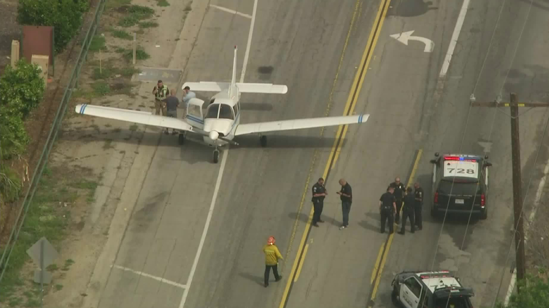 A small plane landed on a street near the Long Beach Airport on April 1, 2019. (Credit: KTLA)