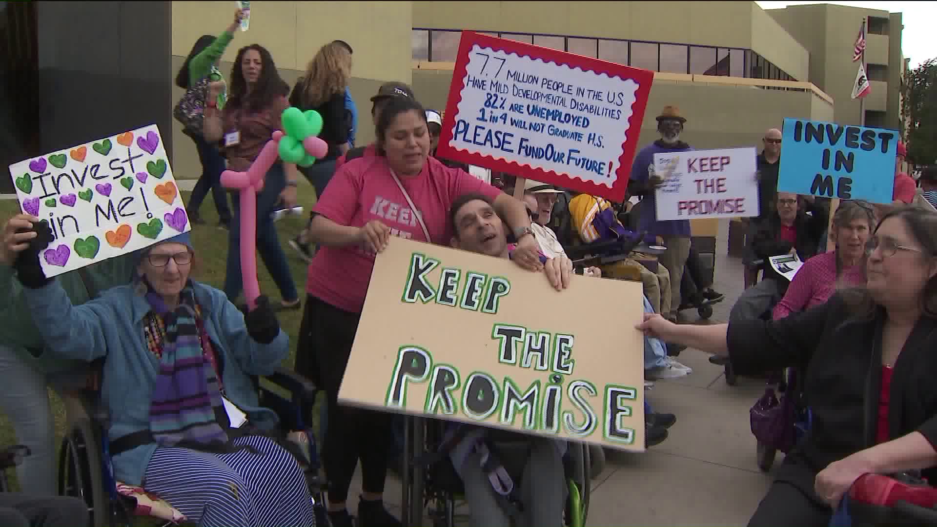 Demonstrators demand increased funding for serviced to help the disabled at a protest outside the state building in Van Nuys on April 5, 2019. (Credit: KTLA)