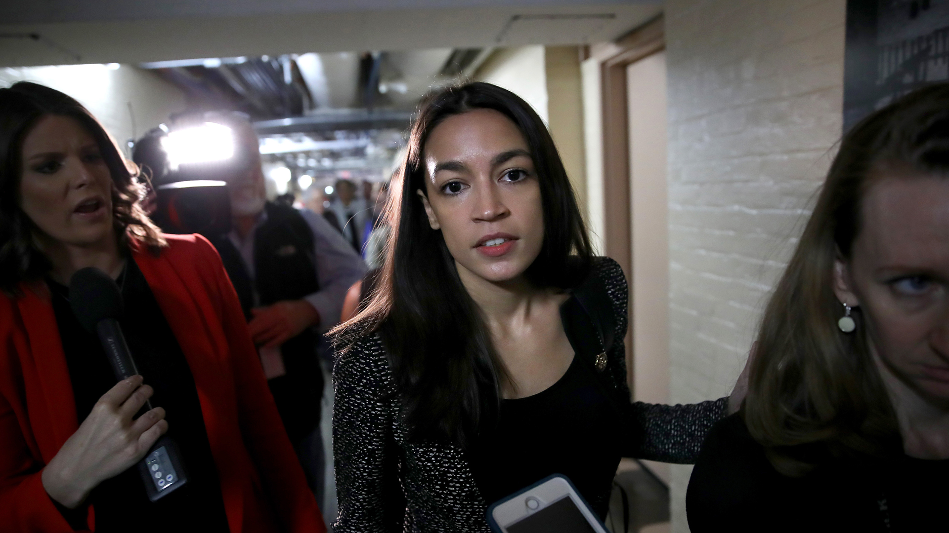 Rep. Alexandria Ocasio-Cortez, D- New York, answers questions from reporters as she leaves a House Democratic caucus meeting on the potential impeachment of President Trump on May 22, 2019 in Washington, DC. (Credit: Win McNamee/Getty Images)