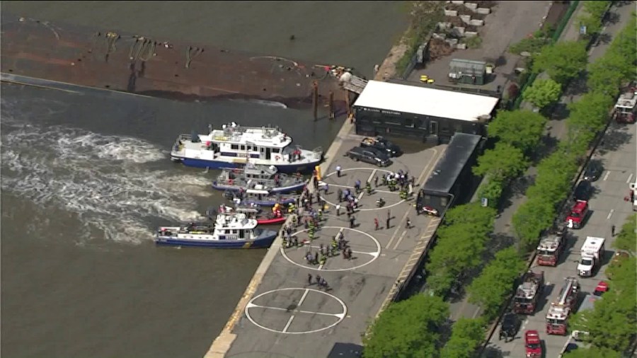 Authorities investigated after a helicopter crashed in the Hudson River in Manhattan on May 15, 2019. (Credit: WPIX)