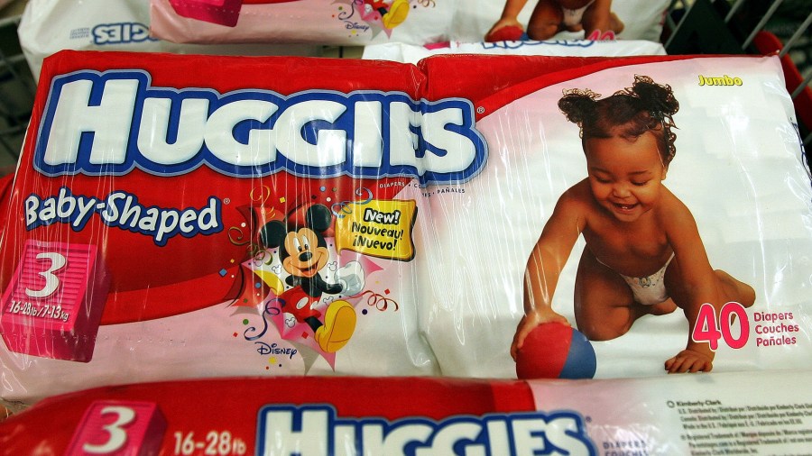 Kimberly-Clark-brand Huggies diapers sit in a shopping cart in a grocery store April 27, 2005 in Chicago. (Credit: Tim Boyle/Getty Images)