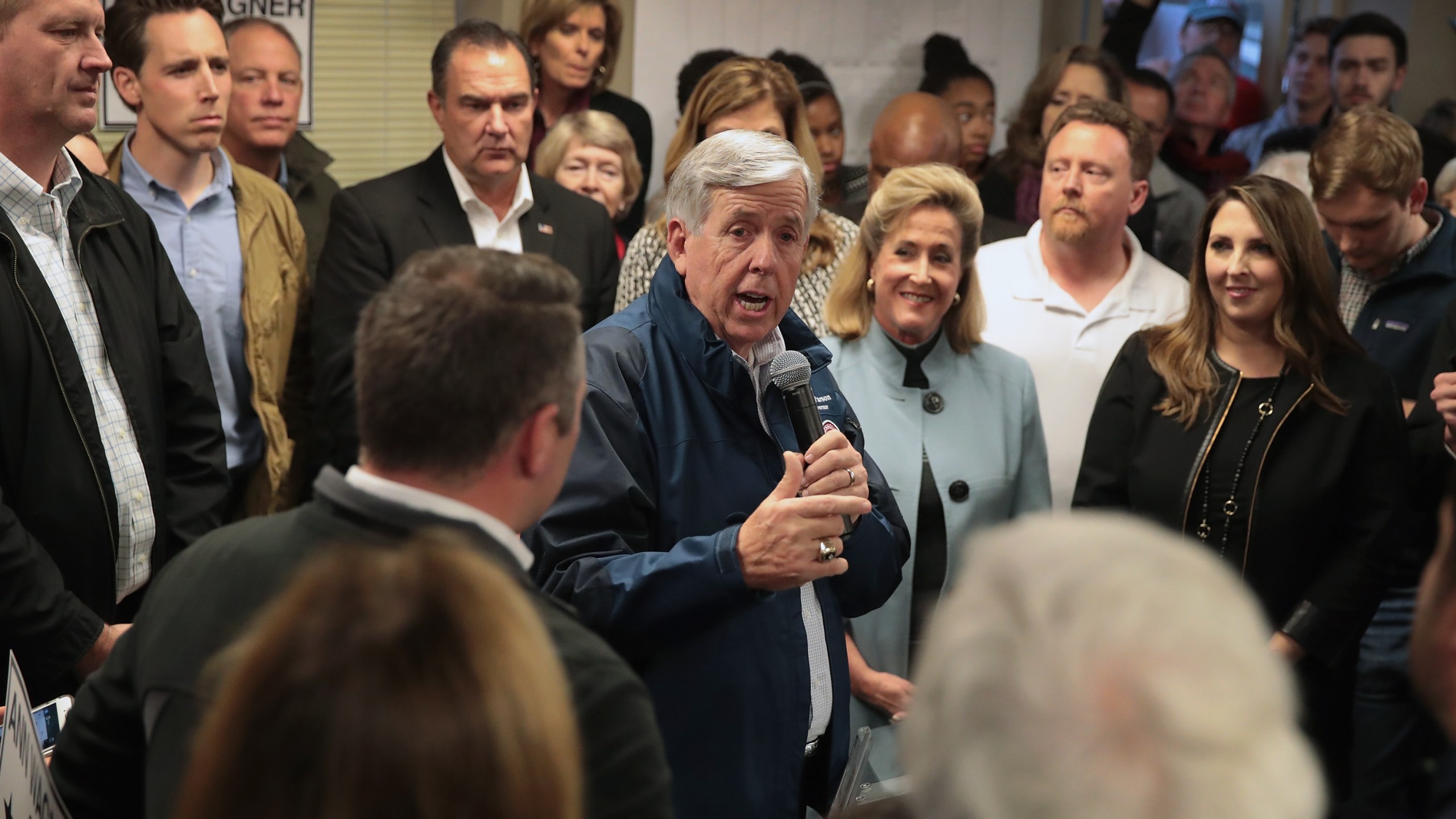 Missouri Governor Mike Parson speaks in support of Republican U.S. Senate candidate Josh Hawley (2nd from L) during a campaign rally at the MOGOP field Office on November 5, 2018 in St. Louis, Missouri. (Credit: Scott Olson/Getty Images)