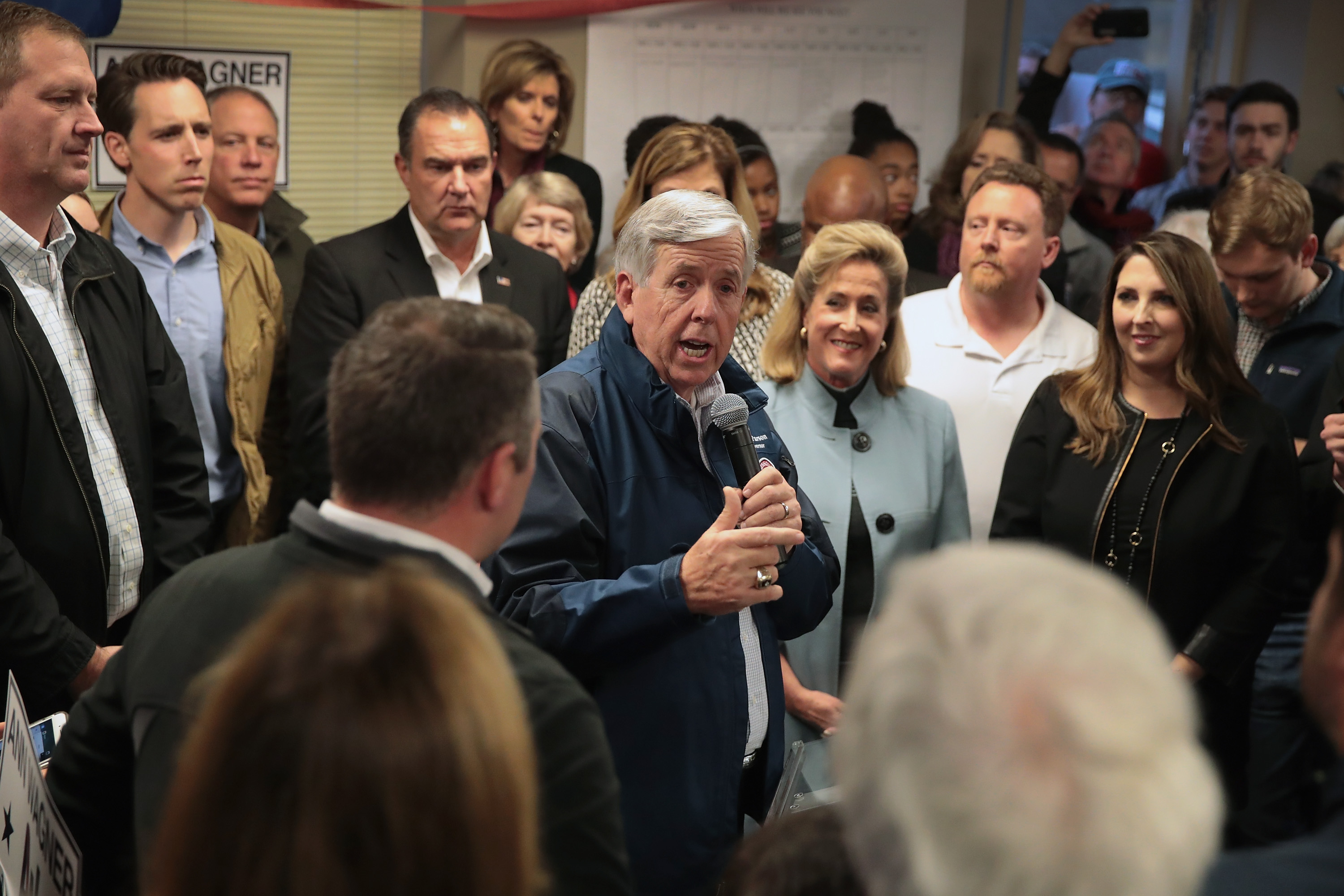 Missouri Governor Mike Parson speaks in support of Republican U.S. Senate candidate Josh Hawley (2nd from L) during a campaign rally at the MOGOP field Office on November 5, 2018 in St. Louis, Missouri. (Credit: Scott Olson/Getty Images)