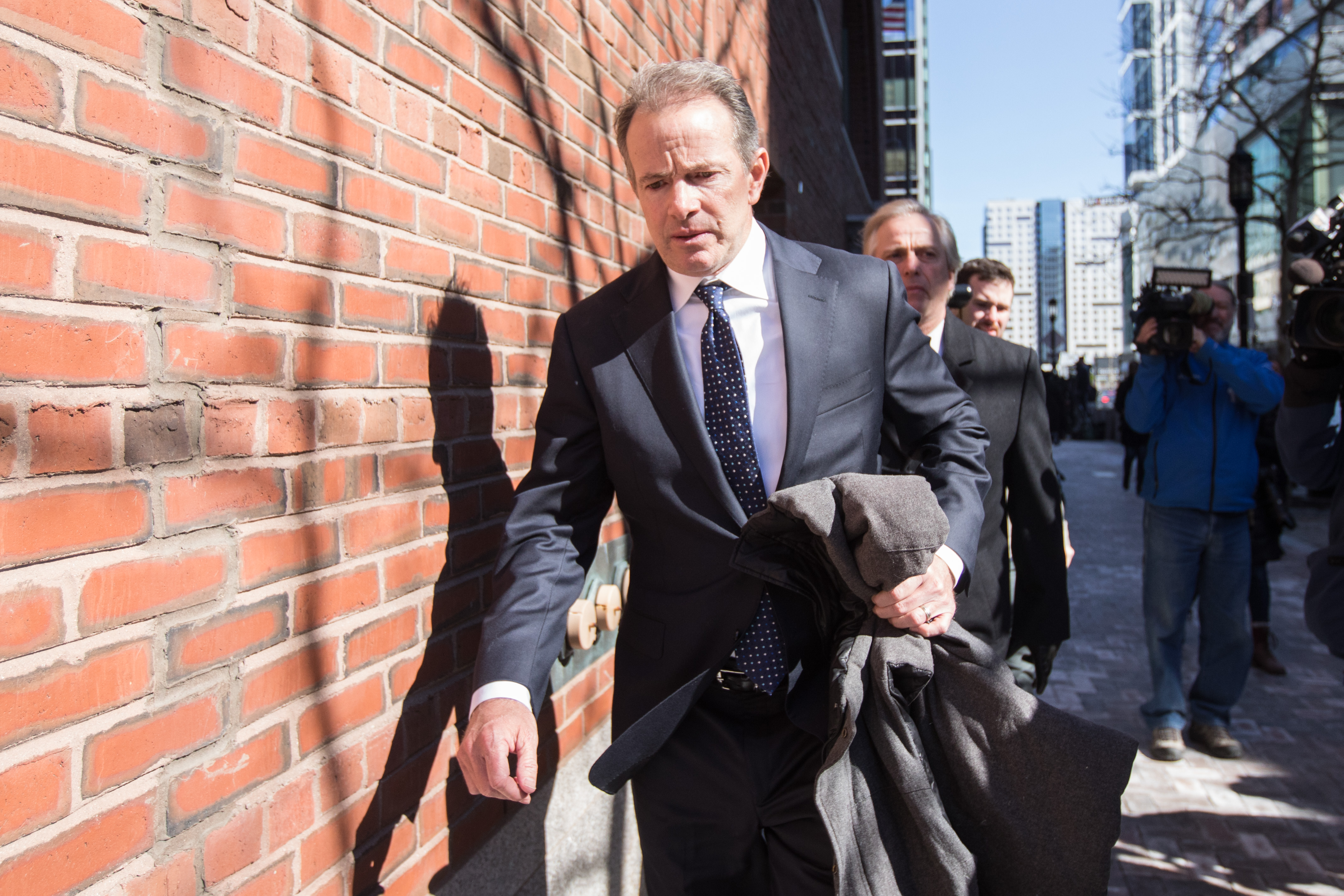 Gordon Ernst, former head coach of the men's and women's tennis teams at Georgetown University, leaves following his arraignment at Boston Federal Court on March 25, 2019 in Boston, Mass. (Credit: Scott Eisen/Getty Images)