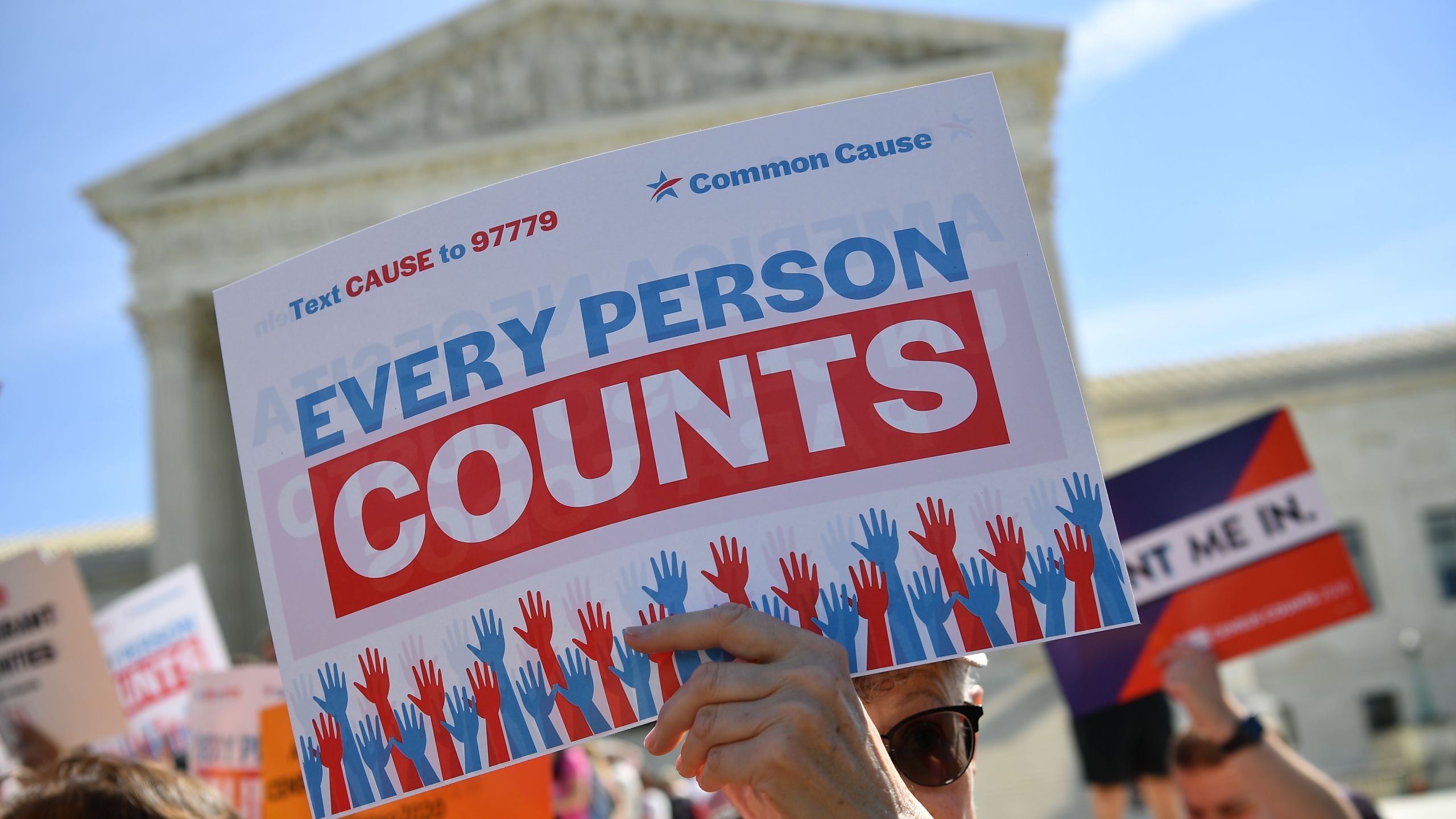 Demonstrators rally at the U.S. Supreme Court in Washington, D.C., on April 23, 2019, to protest a proposal to add a citizenship question in the 2020 census. (Credit: Mandel Ngan / AFP / Getty Images)