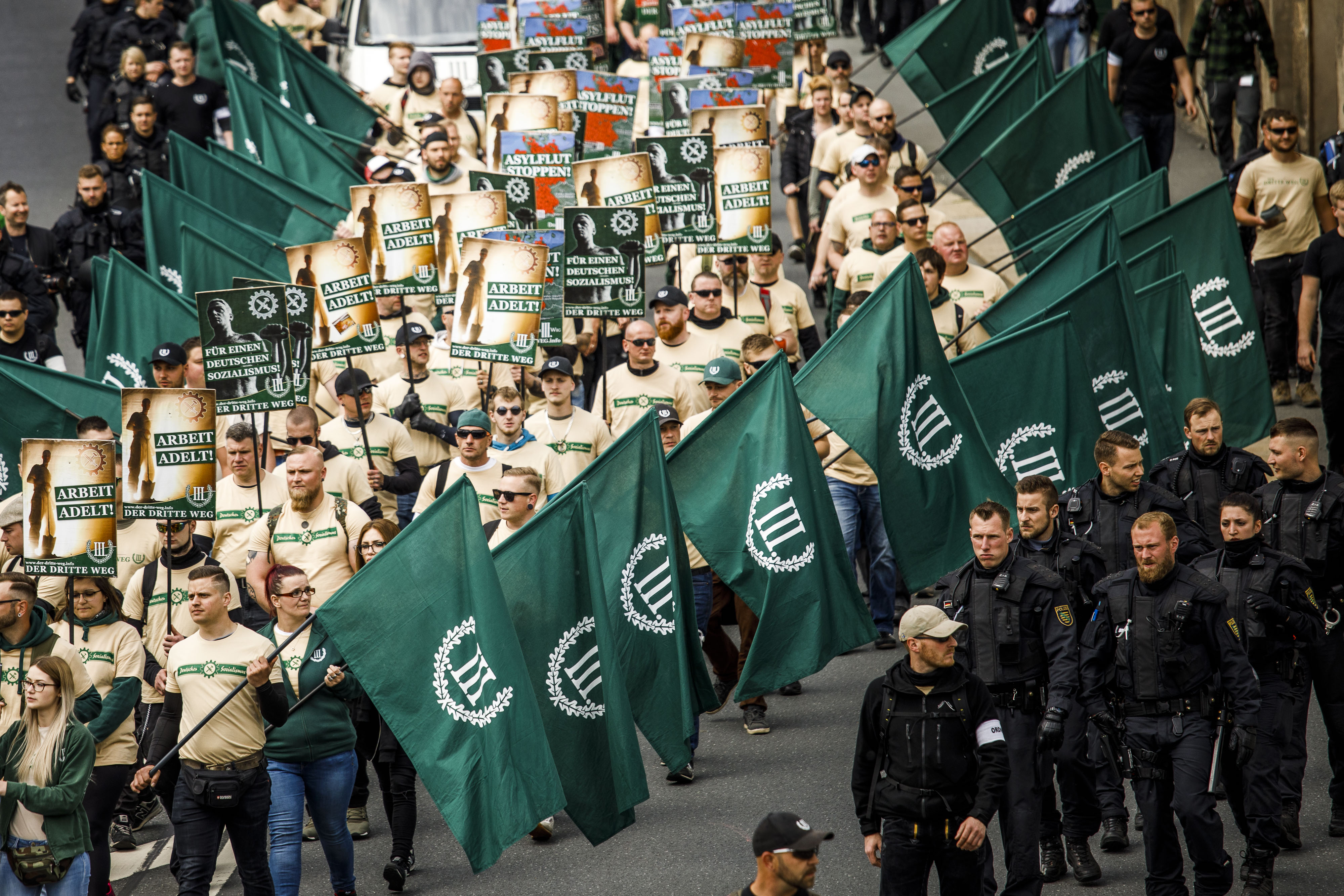 Supporters of the far-right The Third Way (Der Dritte Weg) movement march on May Day on May 1, 2019, in Plauen, Germany. (Credit: Carsten Koall/Getty Images)