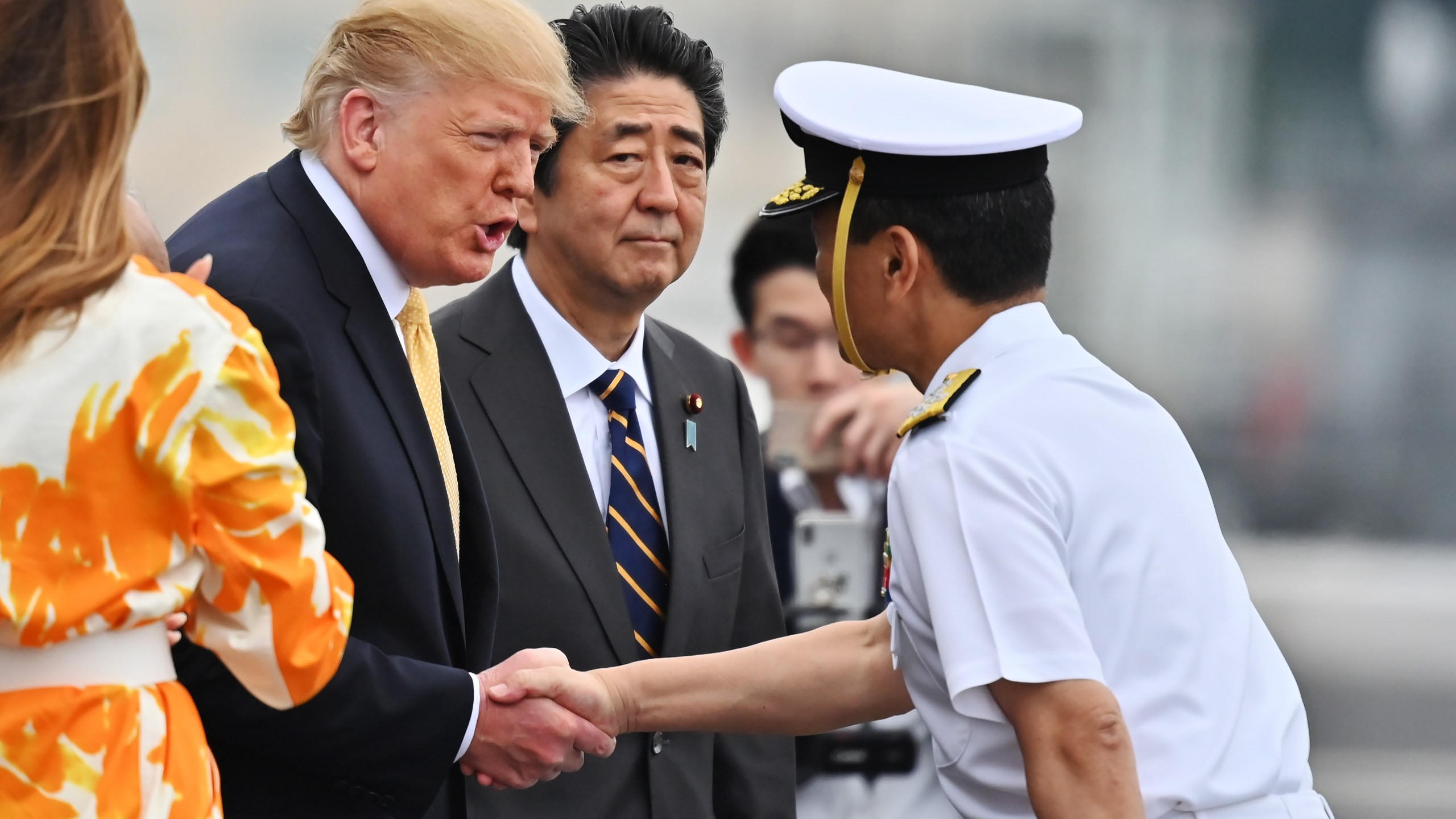 U.S. President Donald Trump handshakes the captain of the ship, Mr. Mizuta, as he leaves the Japan's navy ship Kaga on May 28, 2019, in Yokosuka, Kanagawa, Japan. Trump was on a four-day state visit to Japan, the first official visit of the Reiwa era. (Credit: Charly Triballeau - Pool/Getty Images)