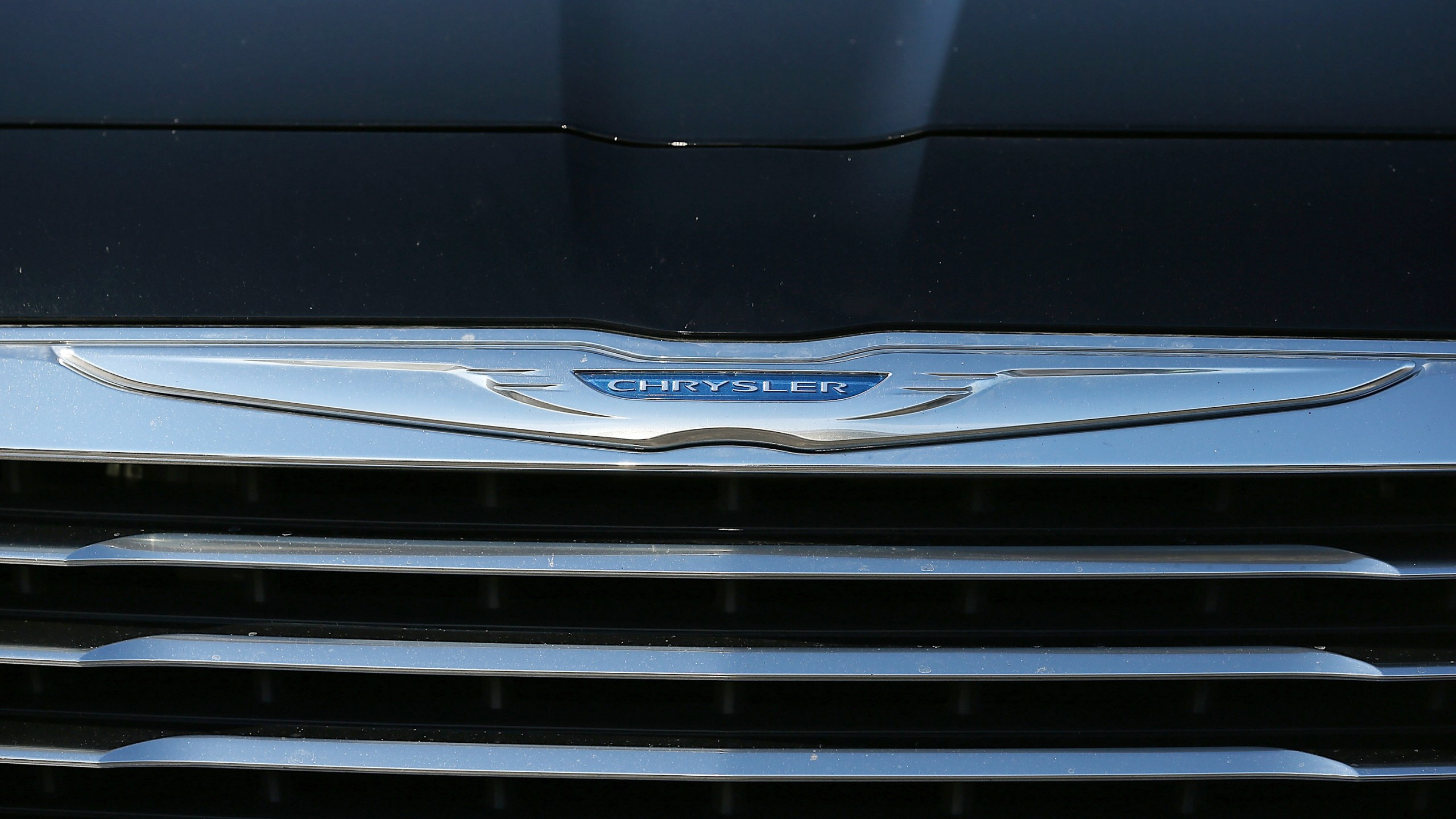 The Chrysler logo is displayed on the front of a brand new car on Jan. 3, 2013, in Colma, California. (Credit: Justin Sullivan/Getty Images)