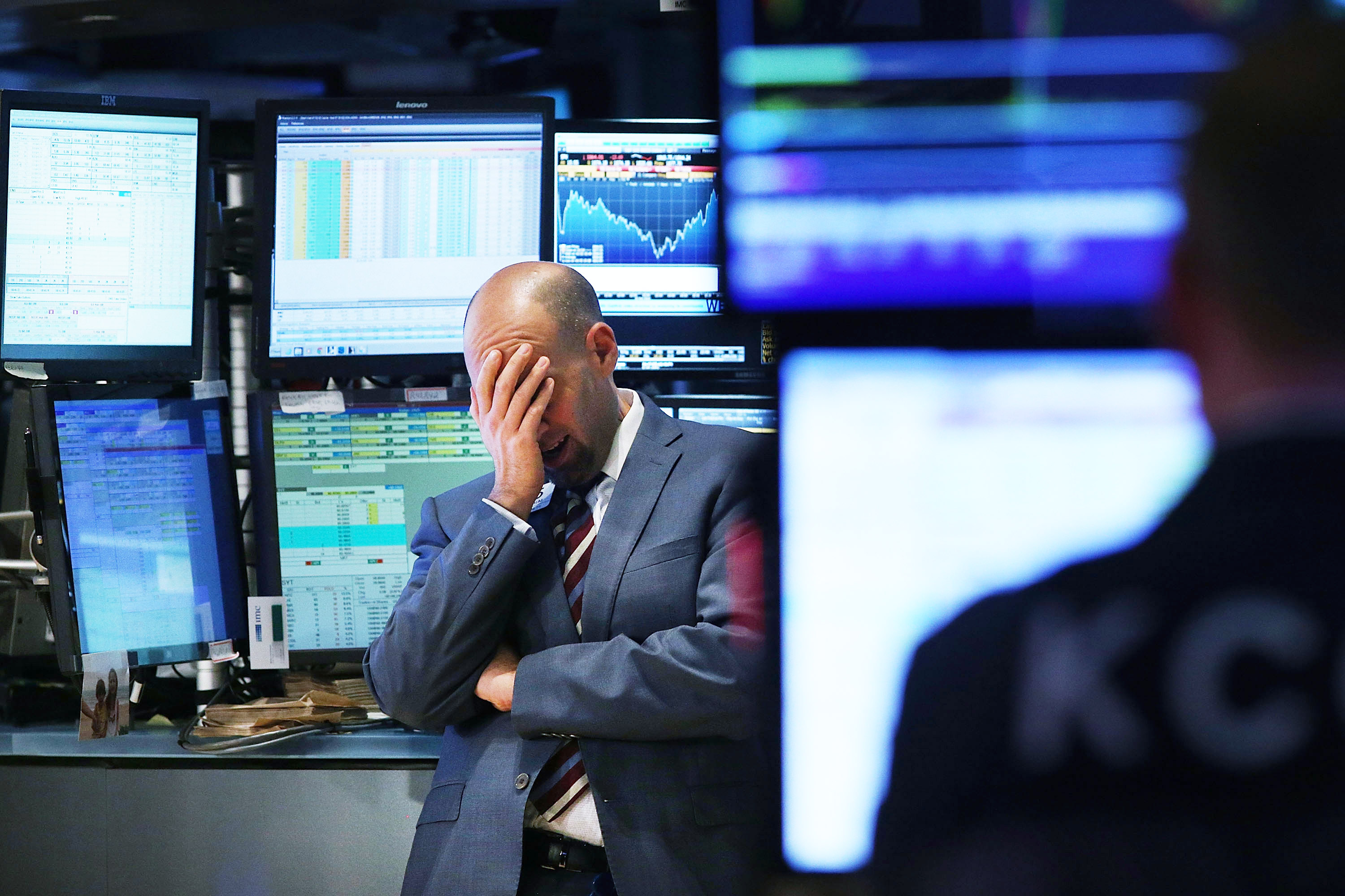 A trader works on the floor of the New York Stock Exchange (NYSE) on October 15, 2014 in New York City. (Credit: Spencer Platt/Getty Images)