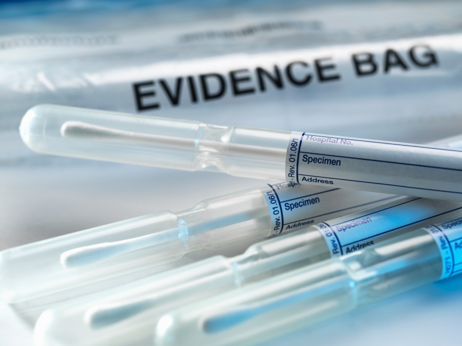 A row of samples from a crime scene on top of genetic testing results are pictured in this undated photo. (Credit: Getty Images)