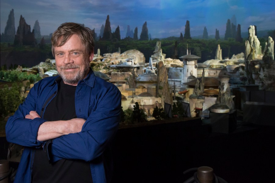 In this handout photo provided by Disney Parks, actor Mark Hamill visits Galaxy's Edge, the new Star Wars-themed land, at Disney Parks on July 14, 2017 in Anaheim, California. (Credit: Joshua Sudock/Disneyland Resort via Getty Images)