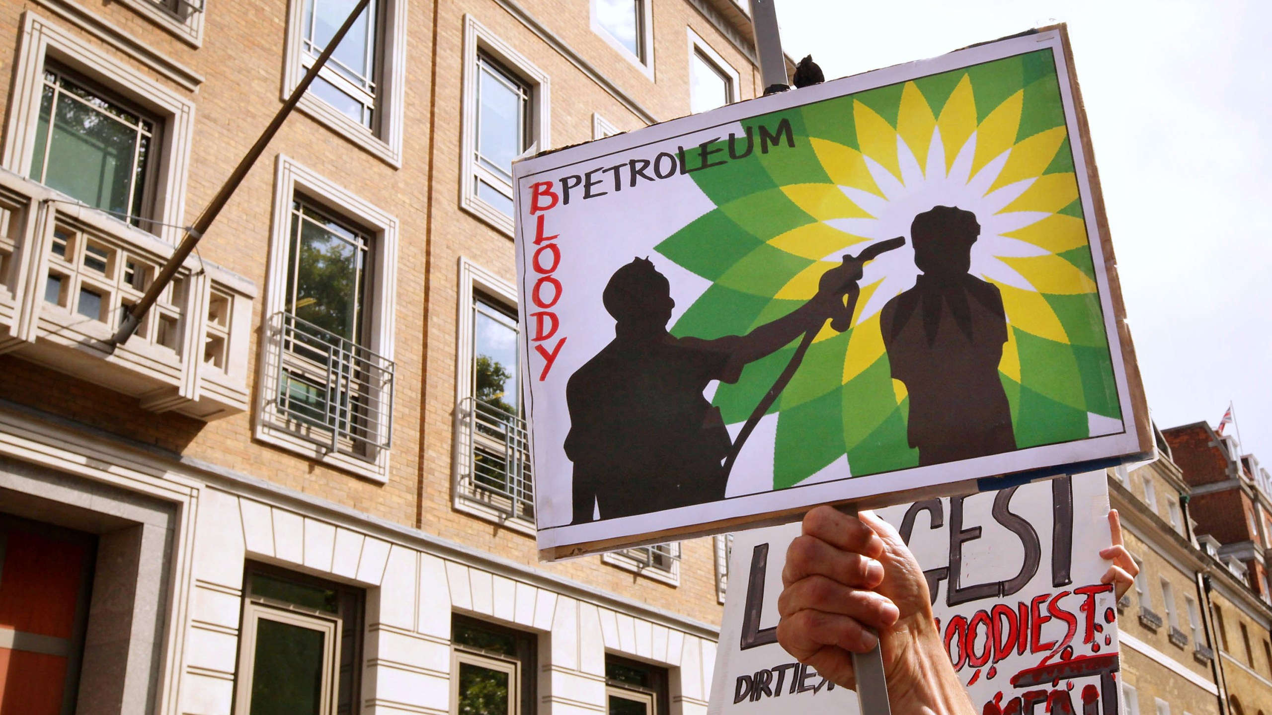 Climate change protesters block the entrance to the British Petroleum headquarters on Sept. 1, 2009 in London. (Credit: Peter Macdiarmid/Getty Images)