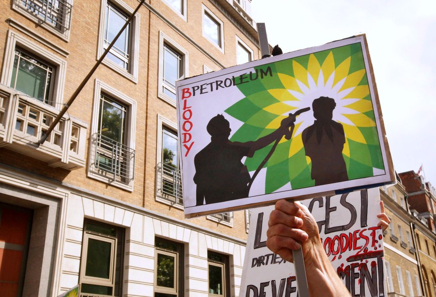 Climate change protesters block the entrance to the British Petroleum headquarters on Sept. 1, 2009 in London. (Credit: Peter Macdiarmid/Getty Images)